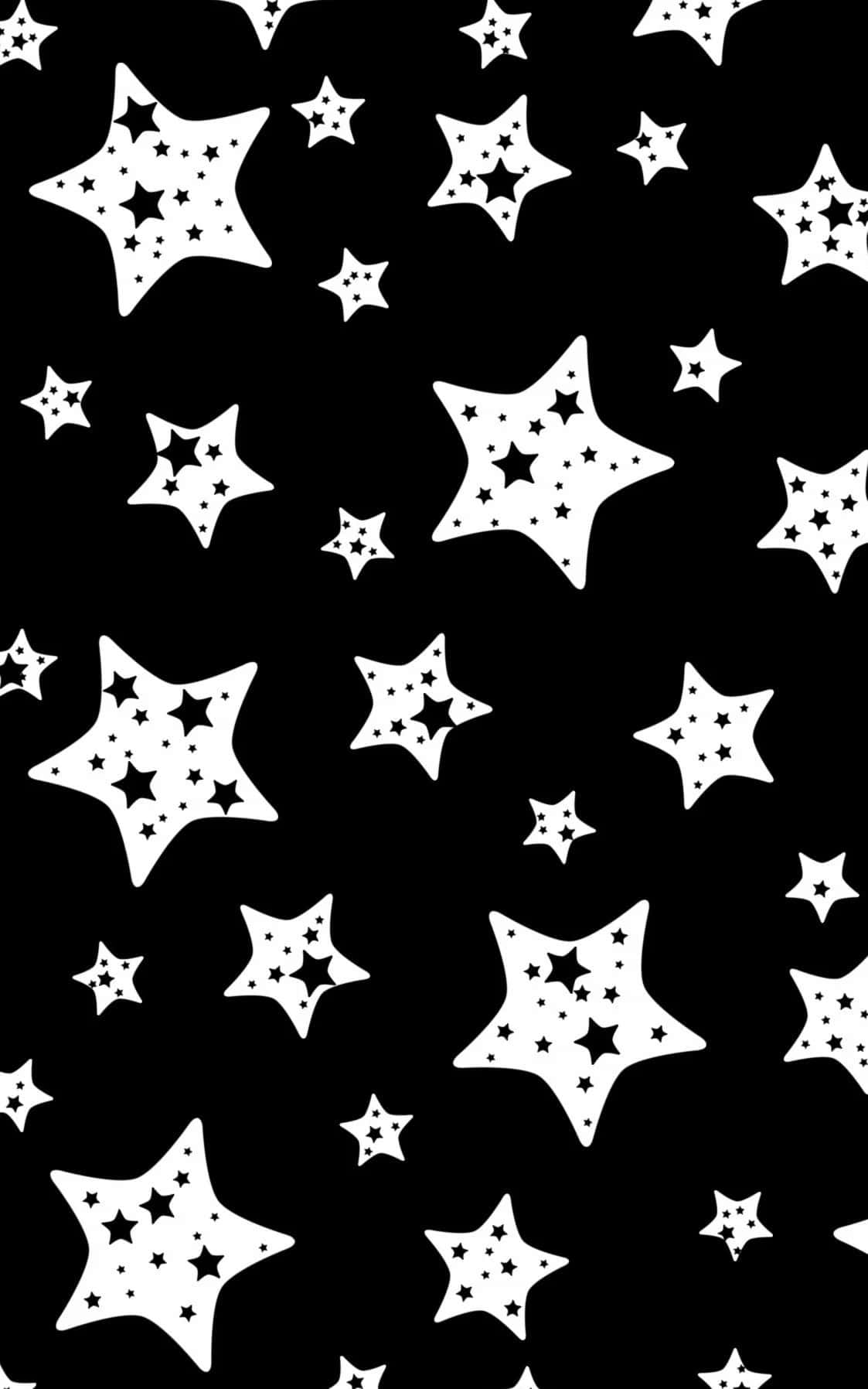 Black And White Star 桌布 壁紙 — 一款大膽的黑白壁紙，散佈著不同大小的星星，內部帶有星星圖案。