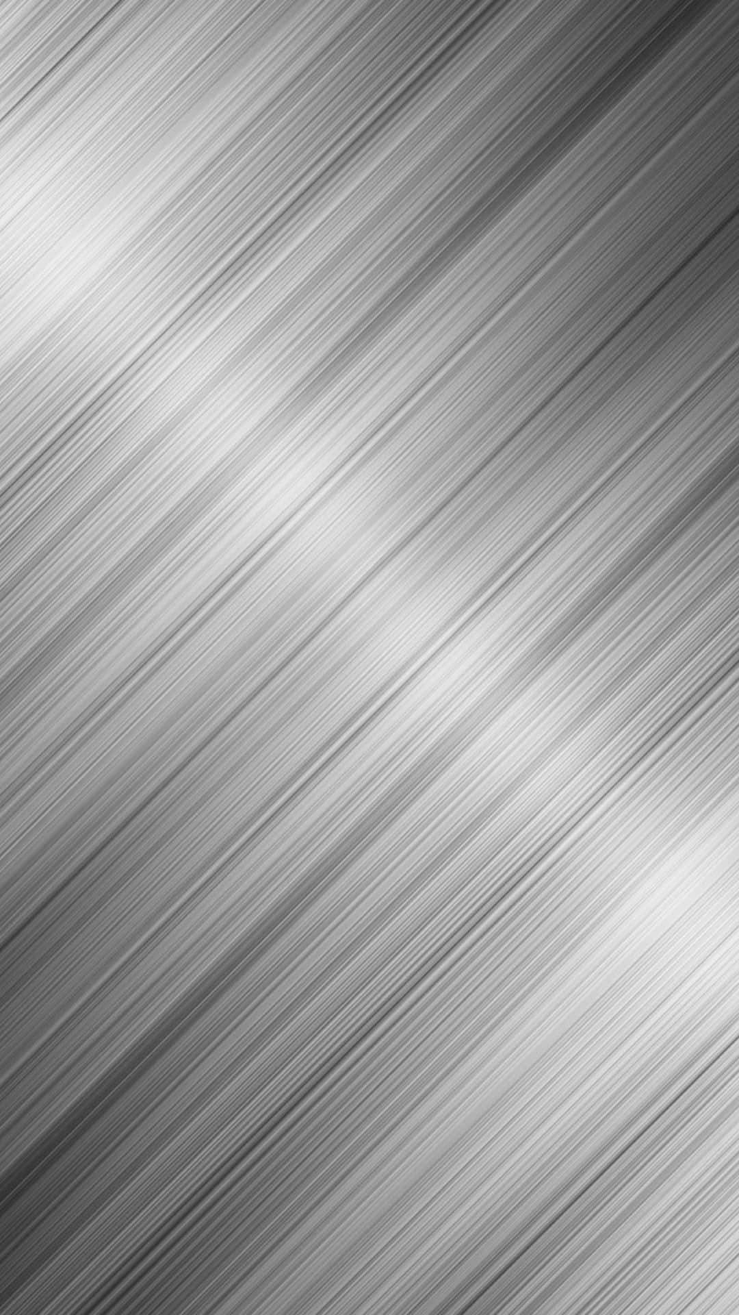 Silver Aesthetic iPhone 桌布 壁紙 — 一款時尚的單色壁紙，帶有從淺灰色到深灰色的對角拉絲金屬紋理漸變。