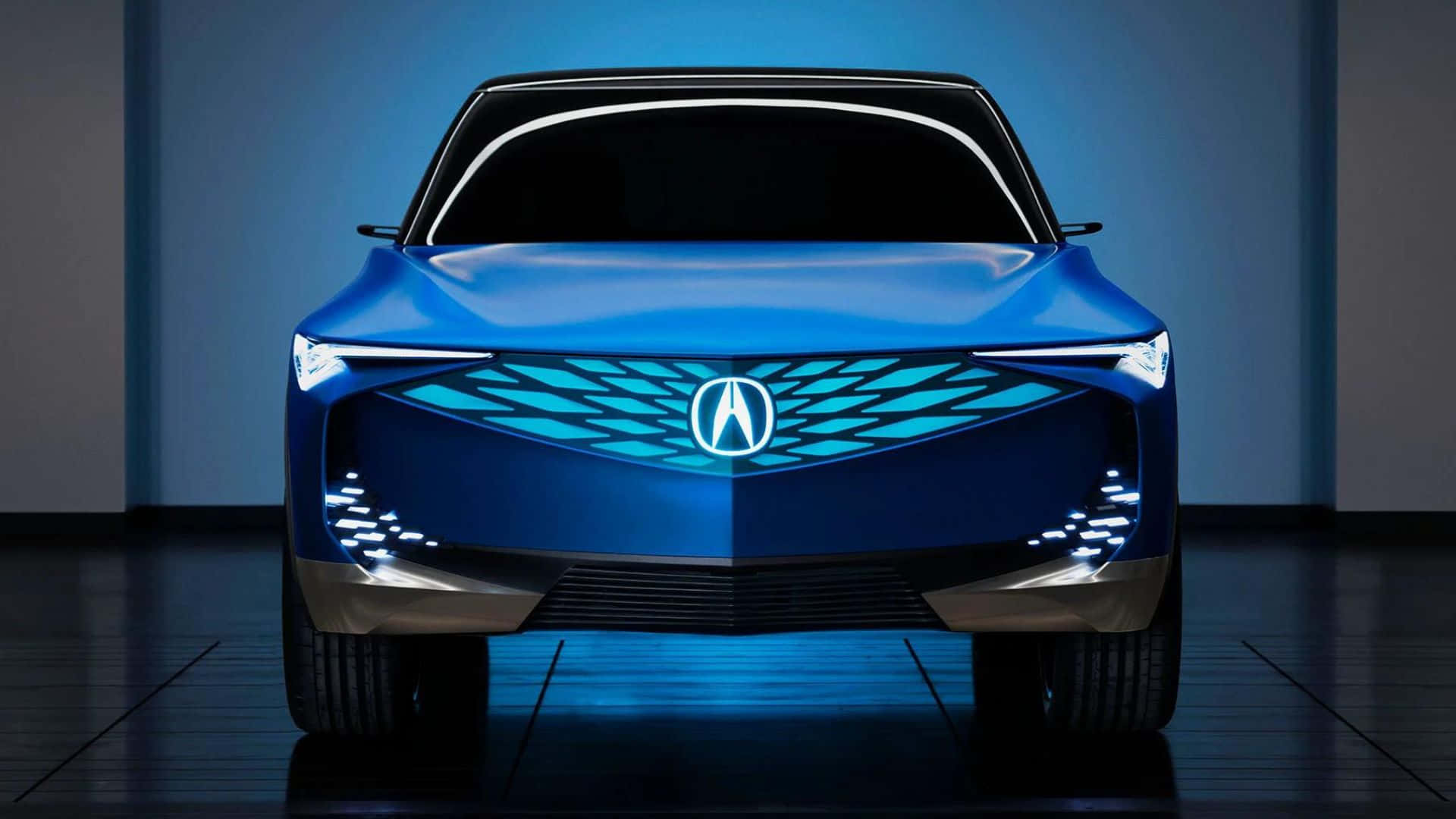 Acura Zdx 桌布 壁紙 — 一款時尚的藍色Acura概念車在工作室燈光下閃耀，配備未來感LED頭燈和發光水箱護罩。