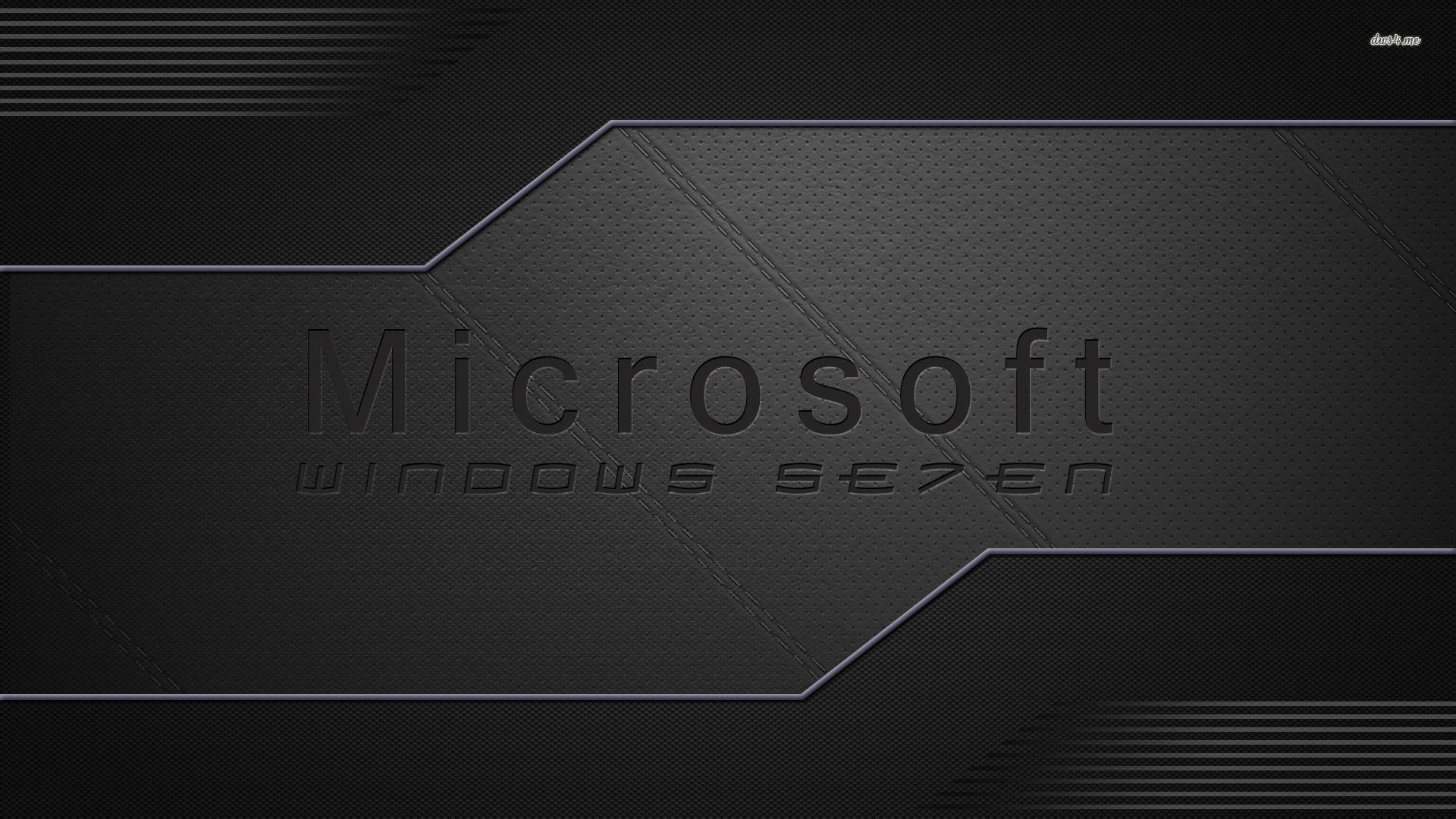 Microsoft Desktop 桌布 壁紙 — 一款時尚的黑色紋理桌布，帶有微妙的浮雕字體Microsoft Windows Seven標誌。