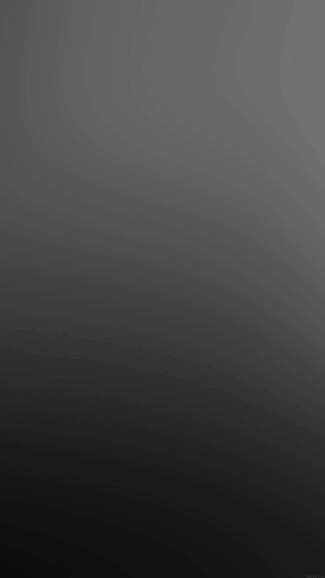 Black Gradient 桌布 壁紙 — 一款極簡漸層桌布，從深灰色過渡到接近黑色，帶有微妙的波浪紋理。