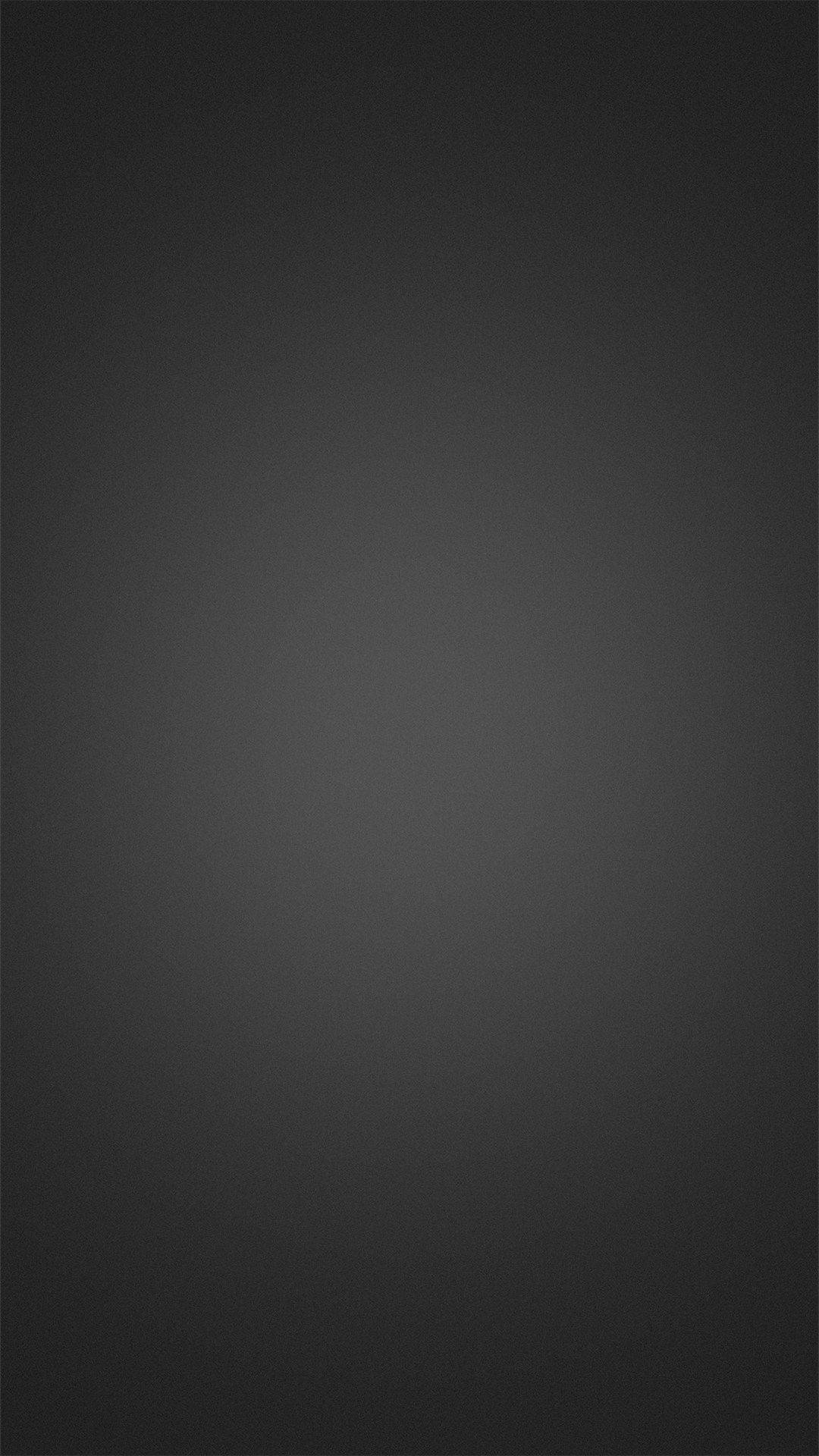 Solid 桌布 壁紙 — 一款極簡漸變壁紙，從深黑色過渡到炭灰色，帶有細微紋理。
