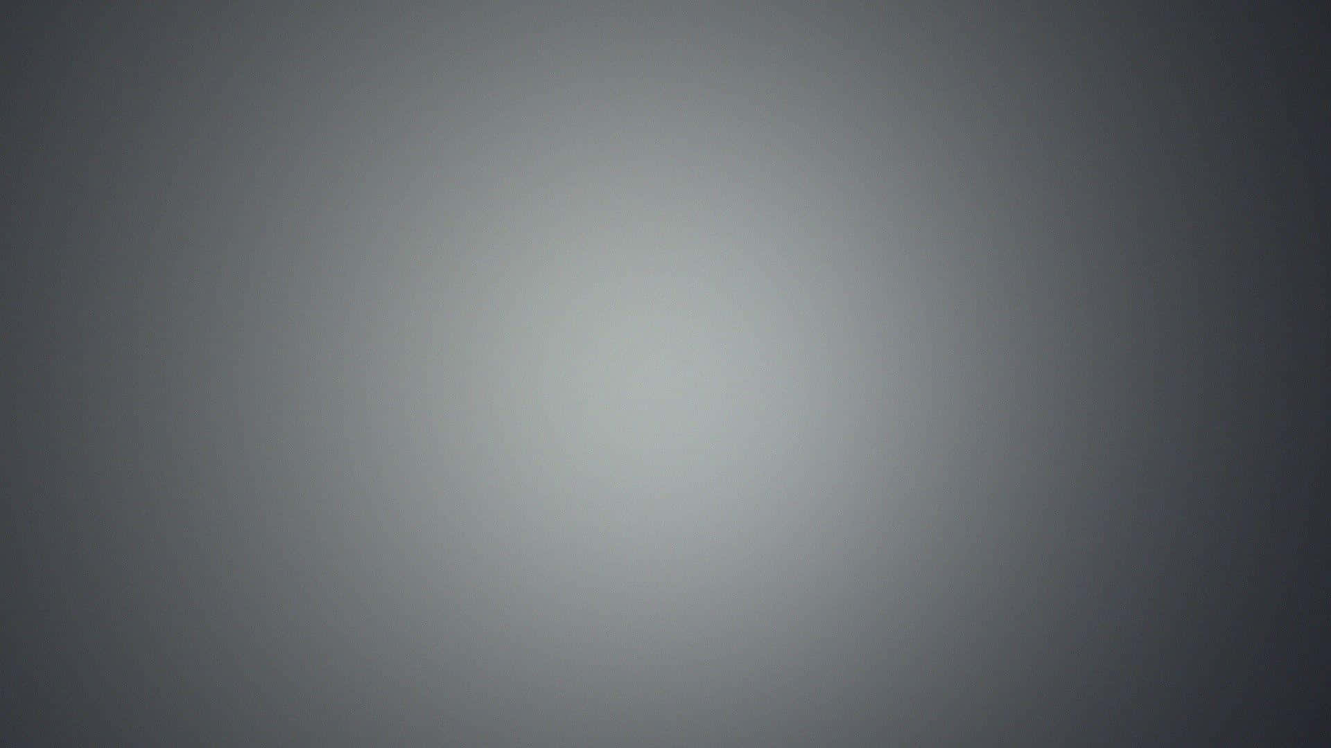 Gray Gradient 桌布 壁紙 — 一款極簡漸變桌布，從深灰色過渡到中央的淺灰色。