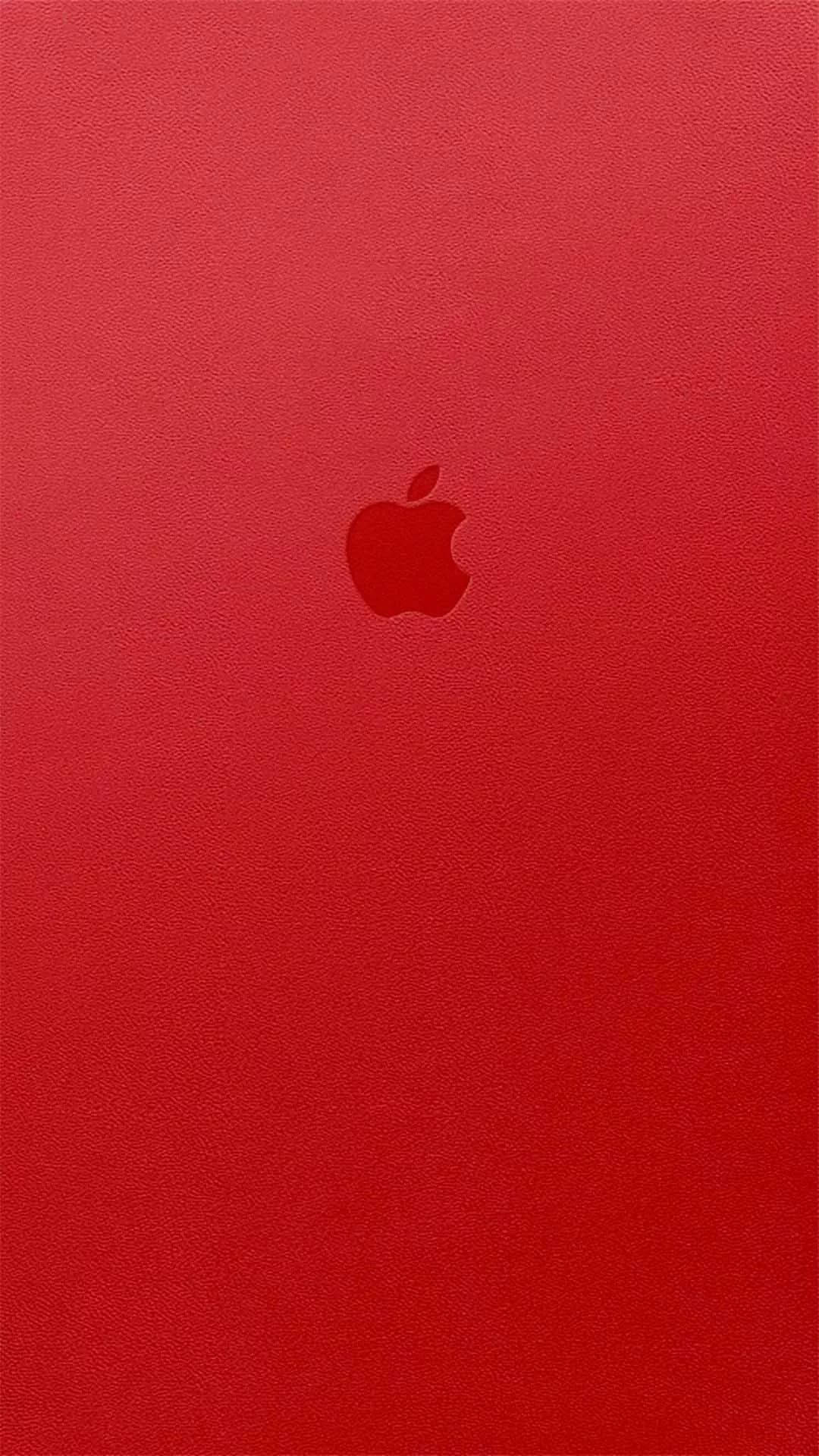 紅色動圖 桌布 壁紙 — 一款極簡的紅色紋理桌布，中央有一個微妙的Apple標誌，背景統一。