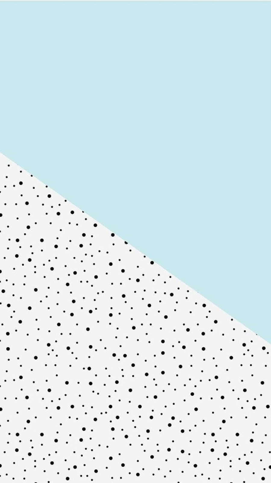 Black And White Dots 桌布 壁紙 — 一款極簡風格桌布，以淺藍色和白色圓點圖案對角分割。