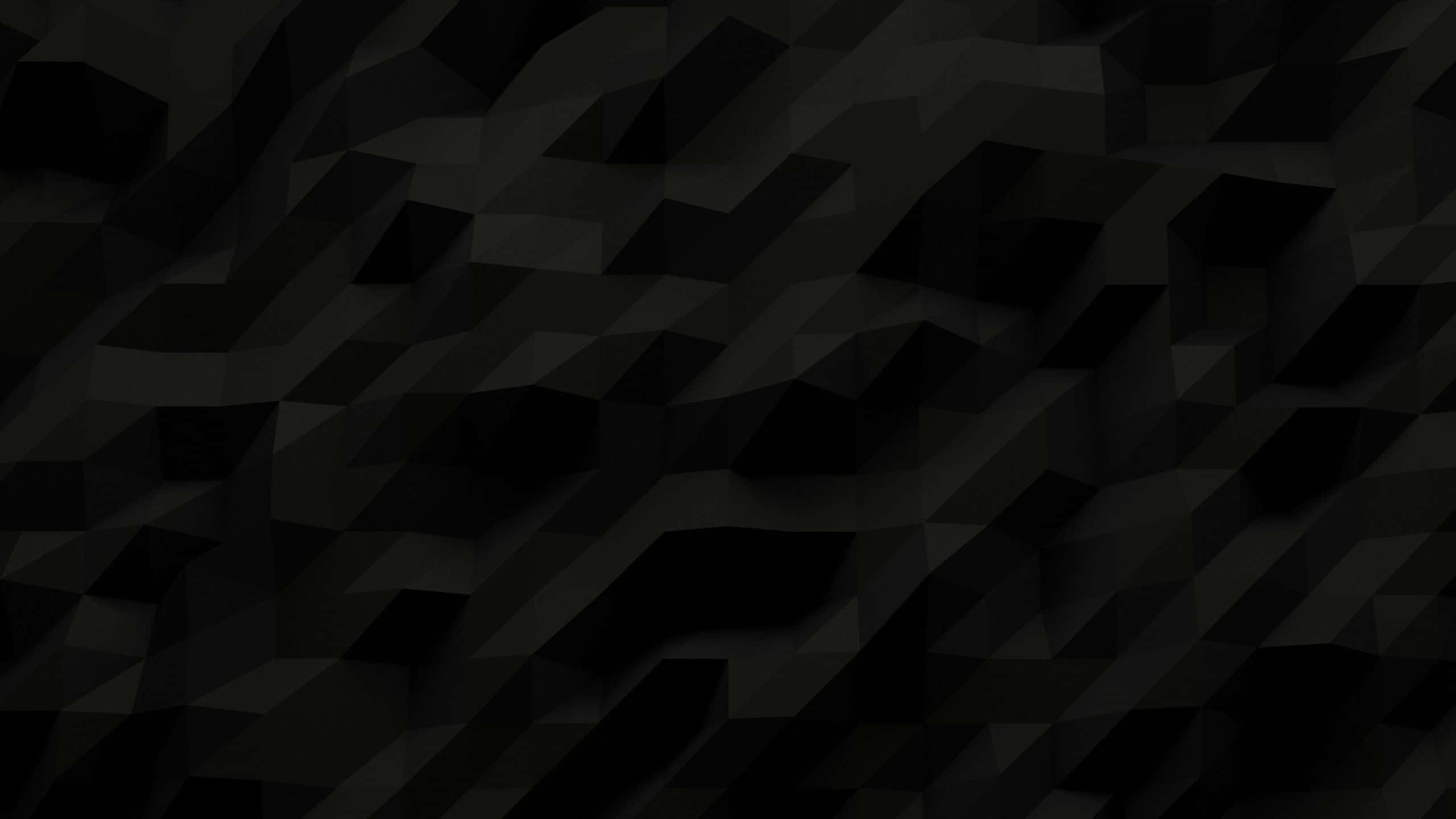 Polygon 桌布 壁紙 — 一款深色抽象壁紙，具有幾何多邊形形狀，呈現不同深淺的黑色和炭灰色。