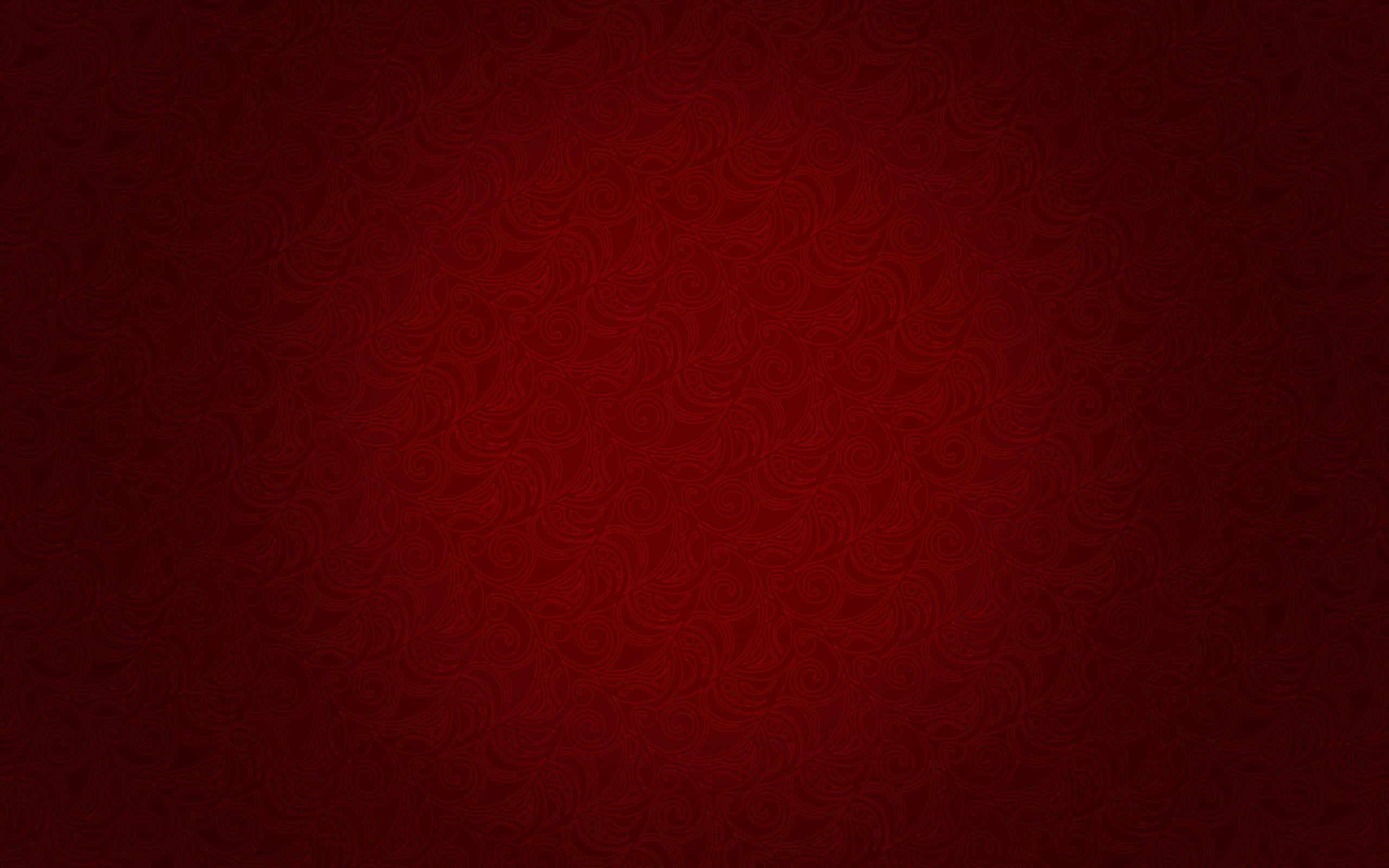 High Resolution Red 桌布 壁紙 — 一款濃郁深紅色的壁紙，帶有微妙的漩渦圖案，向較暗的邊緣漸變。