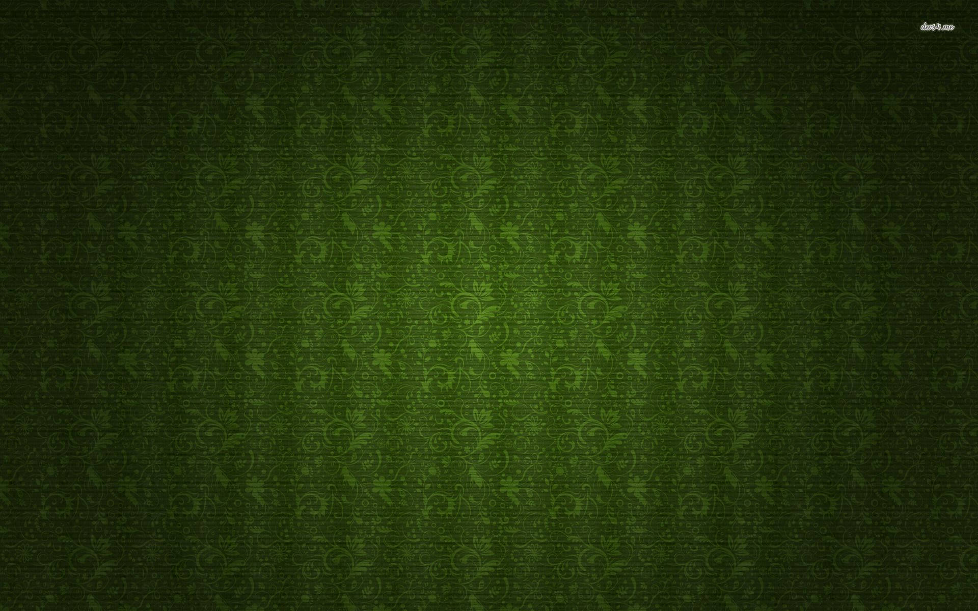 Green Floral 桌布 壁紙 — 一款豐富的綠色壁紙，帶有微妙的 floral swirls，從深色漸變到較淺的綠色中心。