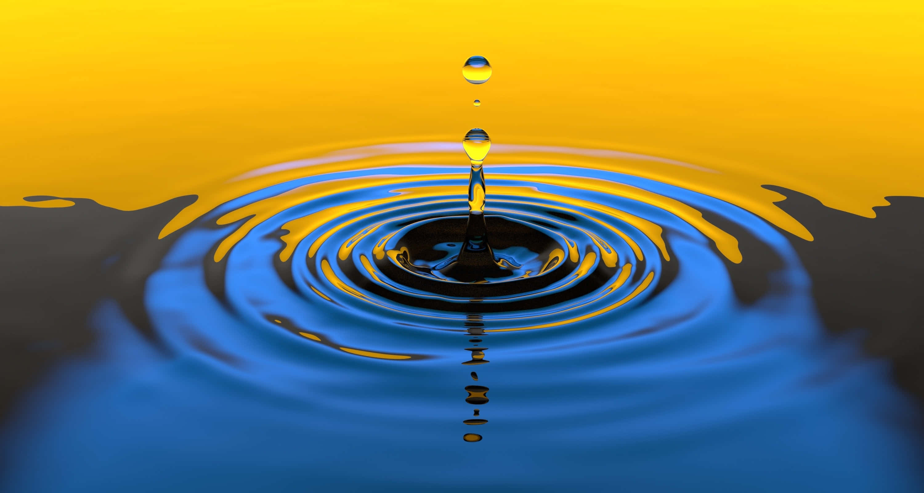 Water Drop 桌布 壁紙 — 一滴完美的水珠懸浮在藍色水池上方，在充滿活力的黃色漸變背景上形成同心漣漪。