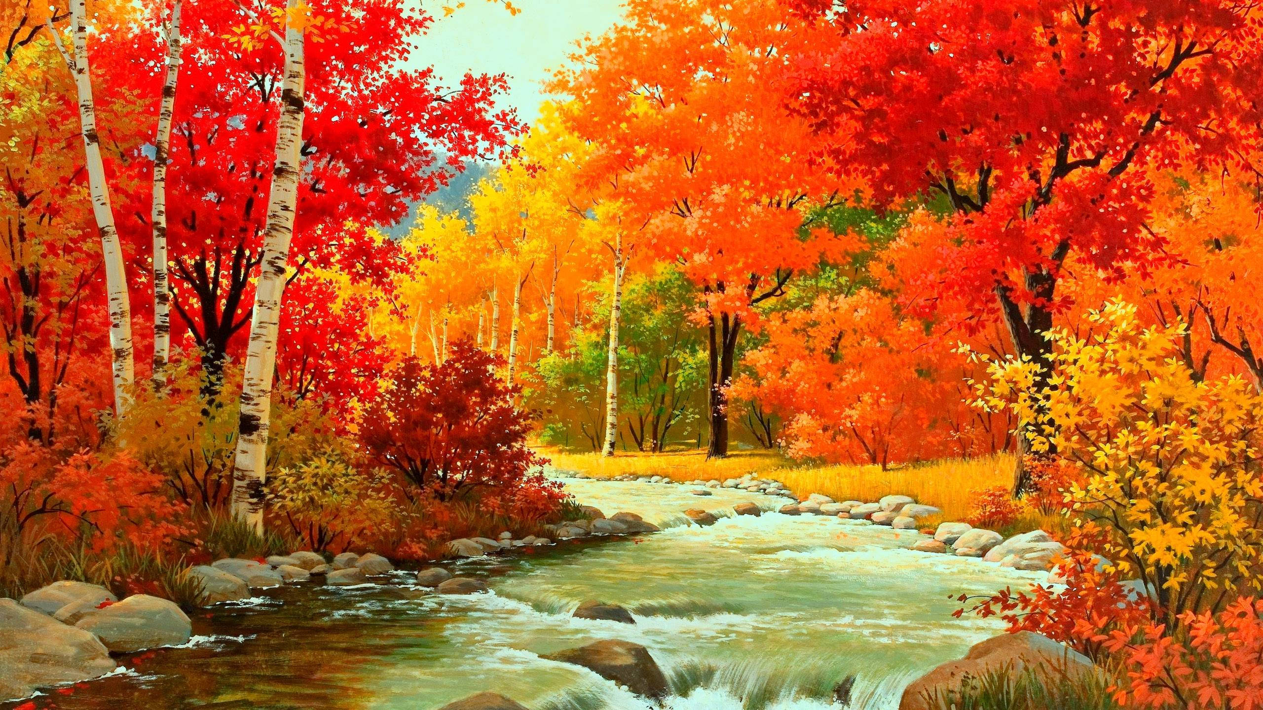 Fall 桌布 壁紙 — 一片充滿活力的秋日森林，火紅和橙色的樹木排列在流經長滿苔蘚岩石的湍急溪流兩旁。