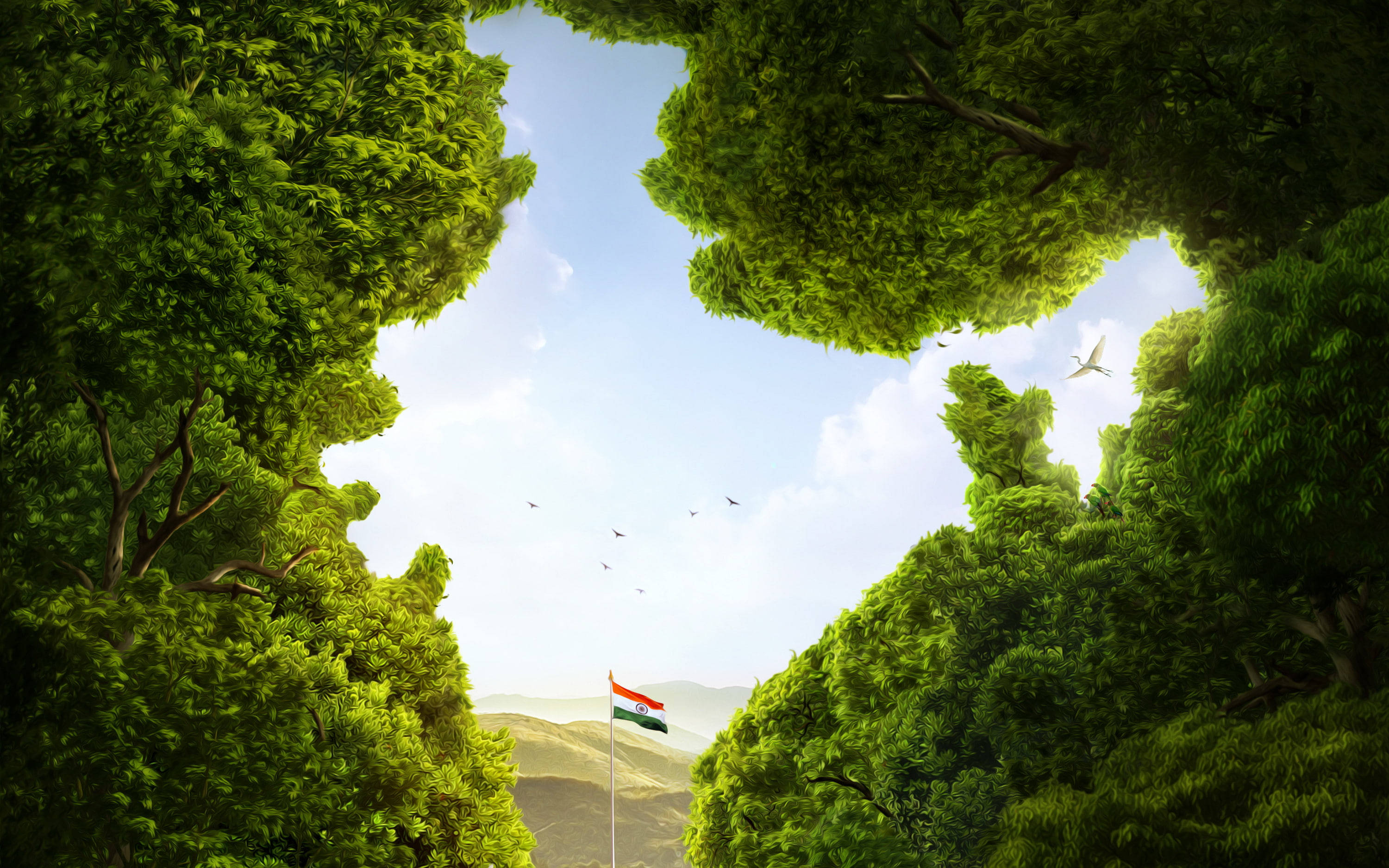 Indian 桌布 壁紙 — 一片充滿活力的綠色森林樹冠框住了晴朗的藍天，下方有飄揚的印度國旗和遠處的山丘。