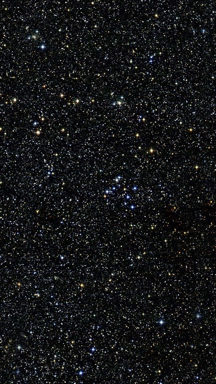 銀河 桌布 壁紙 — 一片密密麻麻的星星在深邃的黑色夜空中閃爍，散佈著藍色和黃色的光點。
