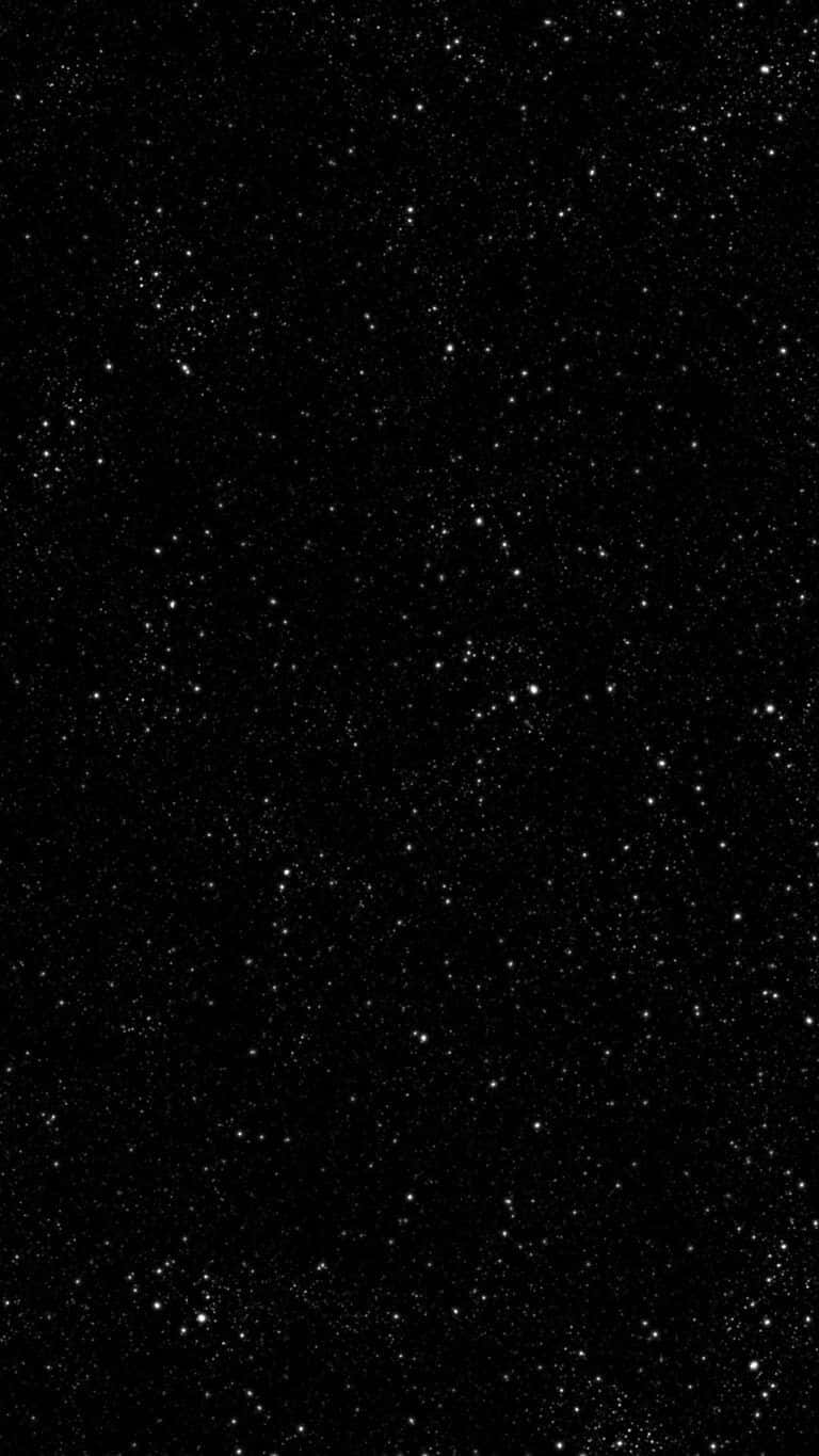 Moon And Stars Phone 桌布 壁紙 — 一片廣闊的閃爍星場，散落在漆黑的夜空之中。