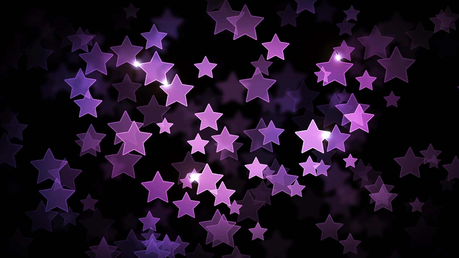 Purple Star 桌布 壁紙 — 一片發光的紫色星星漂浮在深黑色背景上，帶有柔和的光暈。