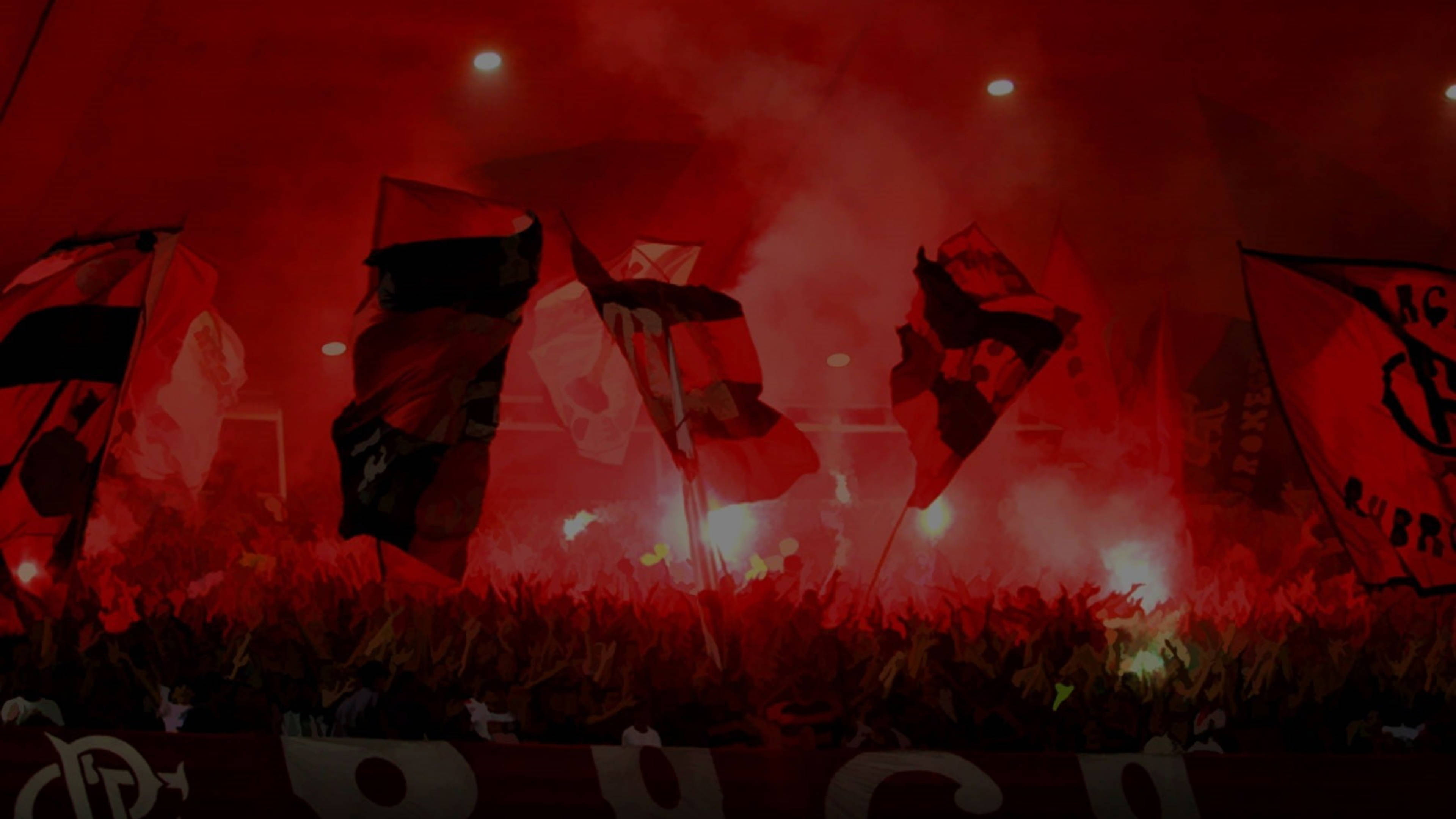 flamengo fc 桌布 壁紙 — 一片紅煙和揮舞的旗幟充滿了體育場，熱情的球迷在明亮的燈光下點燃信號彈。