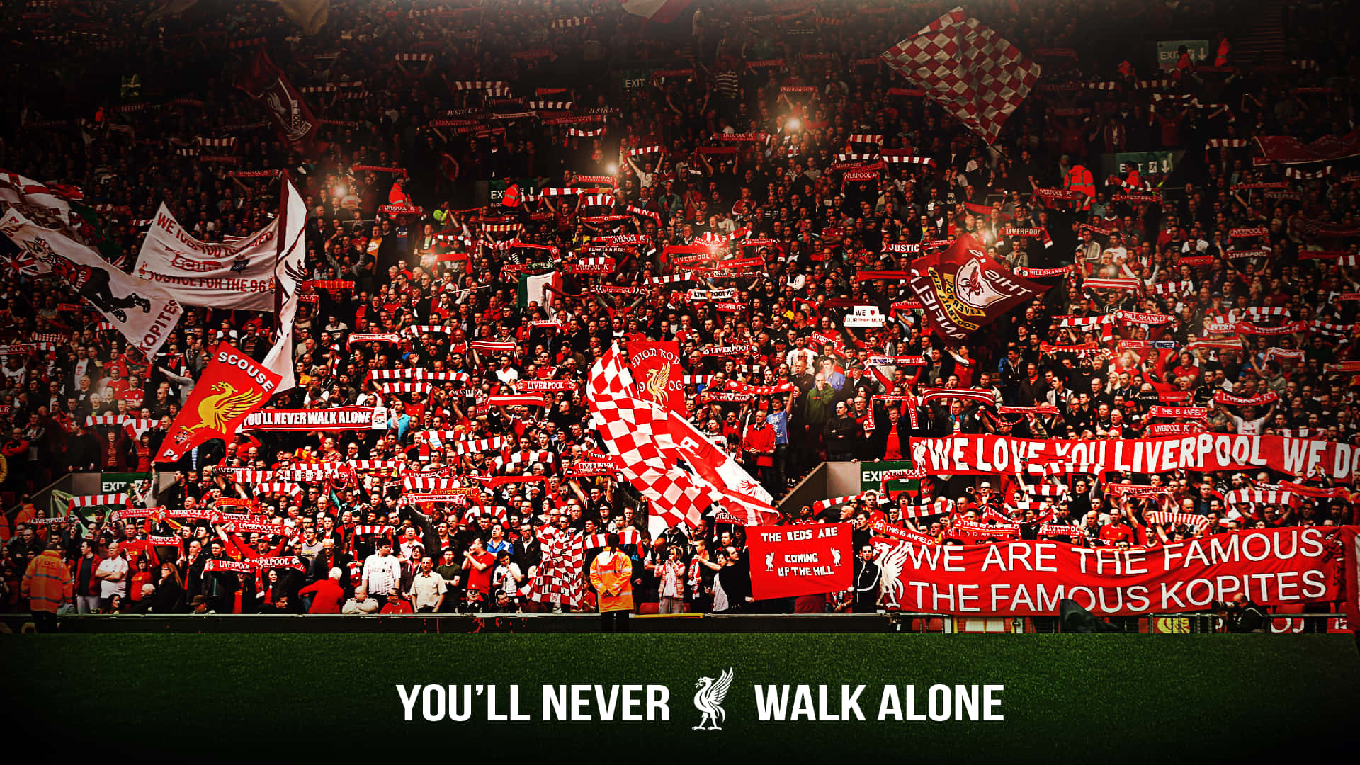 Liverpool Fc Desktop 桌布 壁紙 — 一片紅白色的利物浦球迷在明亮的燈光下，於座無虛席的球場揮舞圍巾和橫幅。