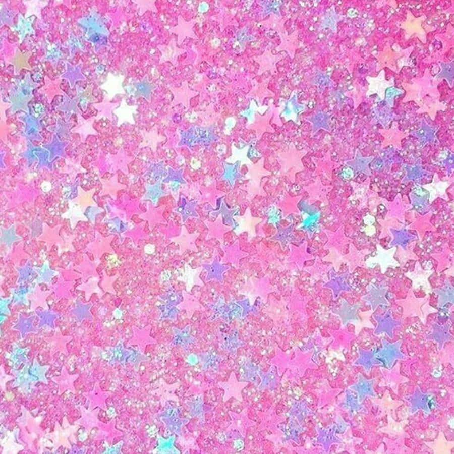 Pink Star 桌布 壁紙 — 一片閃爍的粉紅、紫色和藍色星形亮粉，營造出夢幻般的魔法質感。