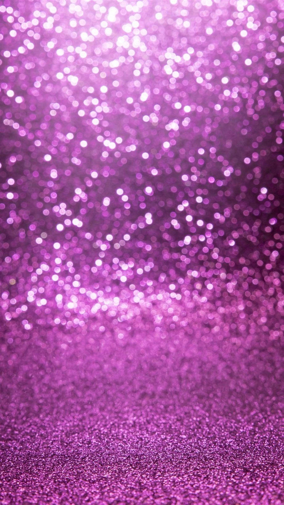 Bokeh 桌布 壁紙 — 一片閃耀的紫色亮粉場地，搭配散景高光，營造出夢幻閃爍的質感。