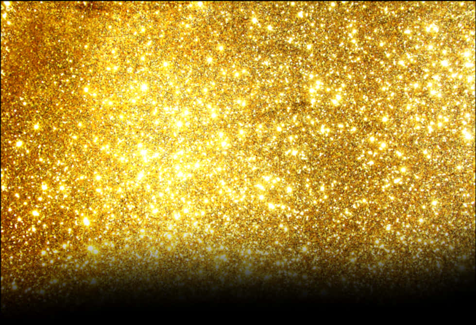 Gold Glitter 桌布 壁紙 — 一片閃耀的金色亮粉在深色漸變底色上閃爍著明亮的高光。