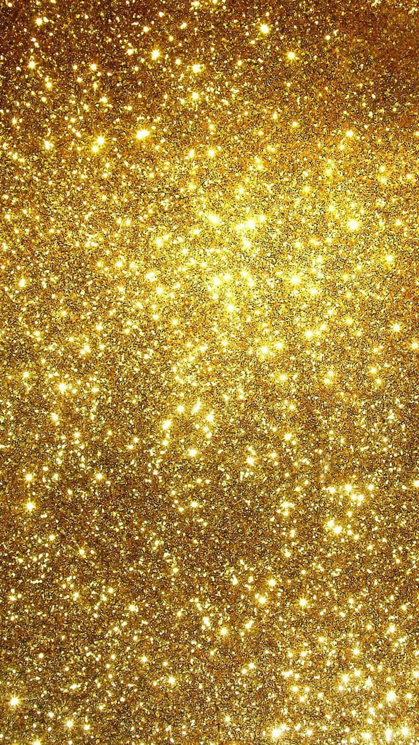 Yellow Glitter 桌布 壁紙 — 一片閃耀的金色亮粉場地，在閃爍的紋理表面上閃爍著明亮的光芒。