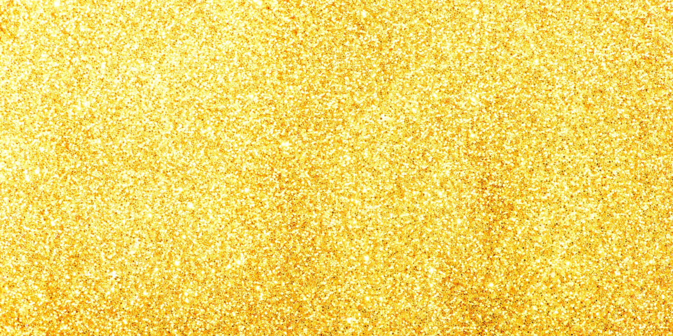 Shimmer 桌布 壁紙 — 一片閃耀的金色亮粉粒子，帶有明亮的反射光芒。
