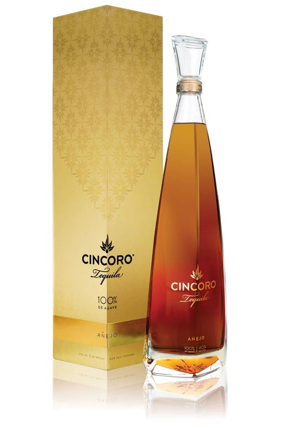 bottle 桌布 壁紙 — 一瓶流線型的Cincoro Añejo龍舌蘭酒，內有金色琥珀色液體，旁邊是其華麗的金色盒子，置於反光的白色表面上。