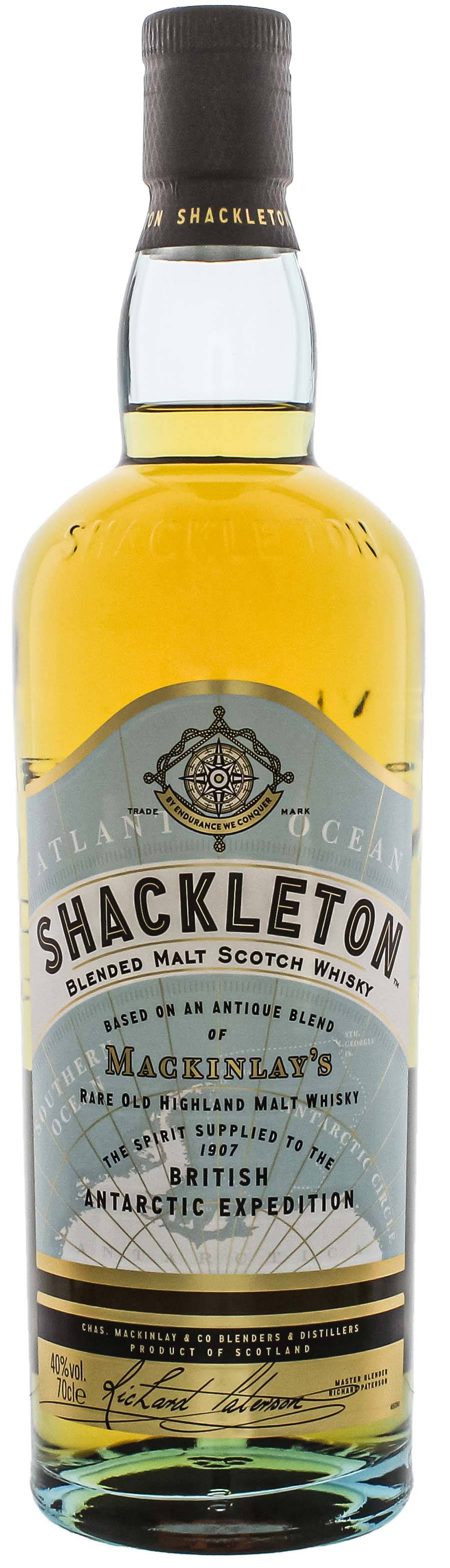 Drink 桌布 壁紙 — 一瓶高身的Shackleton調和麥芽蘇格蘭威士忌，帶有金色液體和復古南極探險標籤。