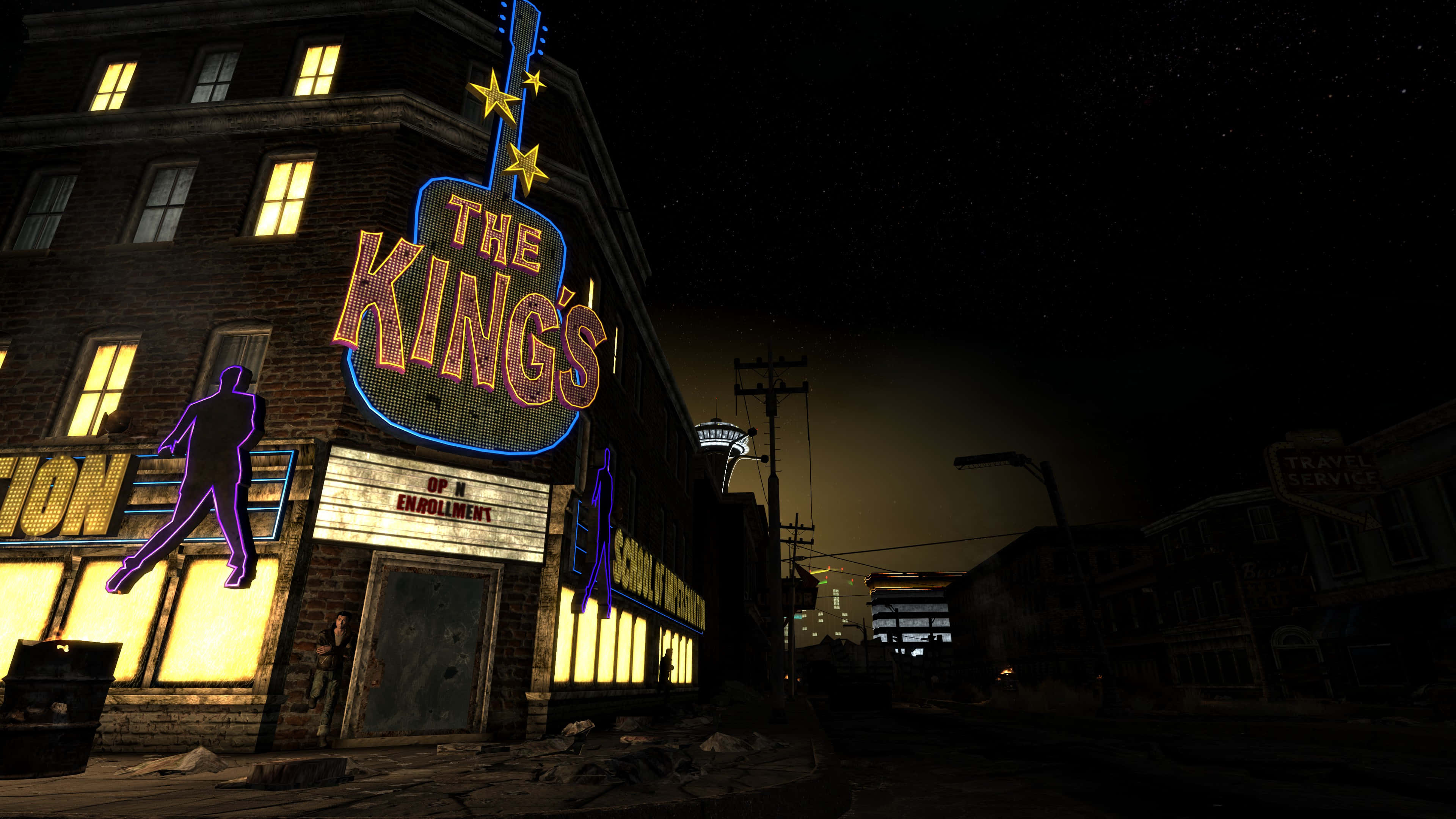 Fallout Nv 桌布 壁紙 — 一盞為「The King's」而設的霓虹燈吉他招牌，在繁星點點的夜空下，於一棟粗糙都市環境中的磚砌建築上發光。