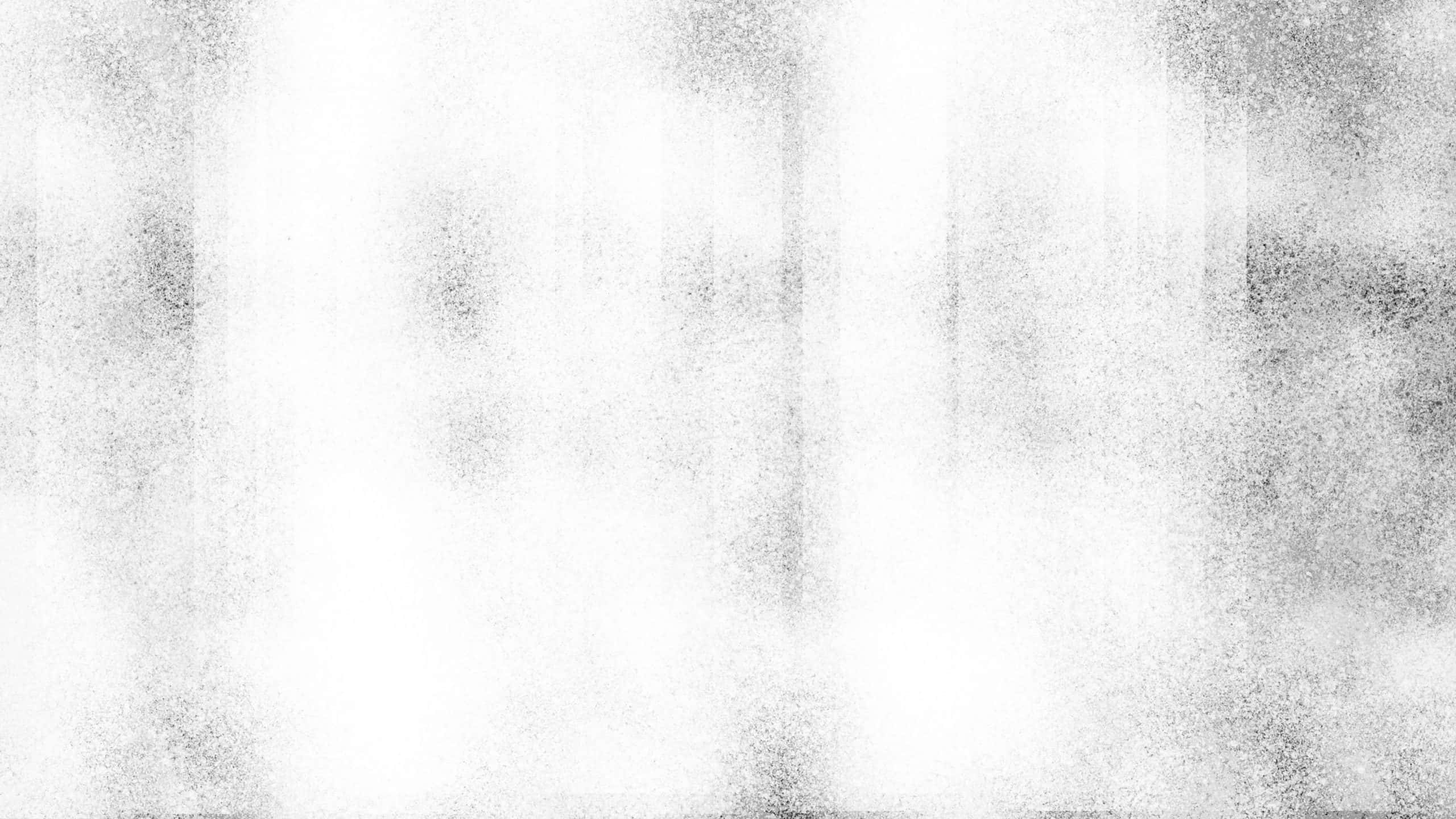 Black And White Texture 桌布 壁紙 — 一種單色抽象紋理，帶有斑點灰白漸變，營造出柔和模糊的效果。