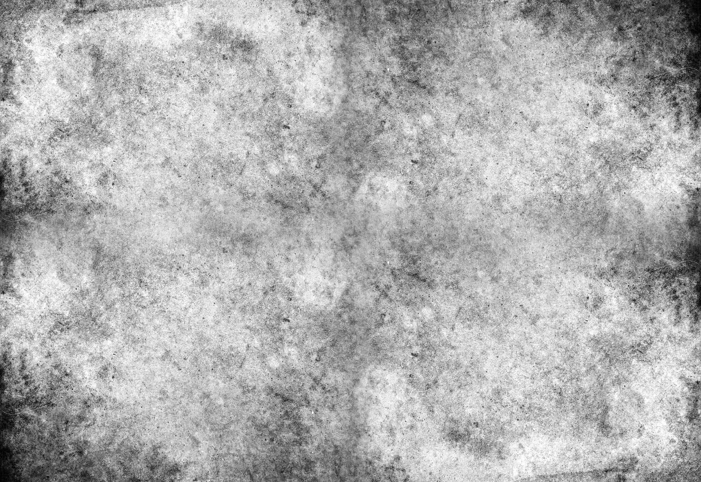 Dark Grunge 桌布 壁紙 — 一種風化的單色紋理，帶有粗糙的斑點和褪色的斑塊，類似於舊紙張或混凝土。