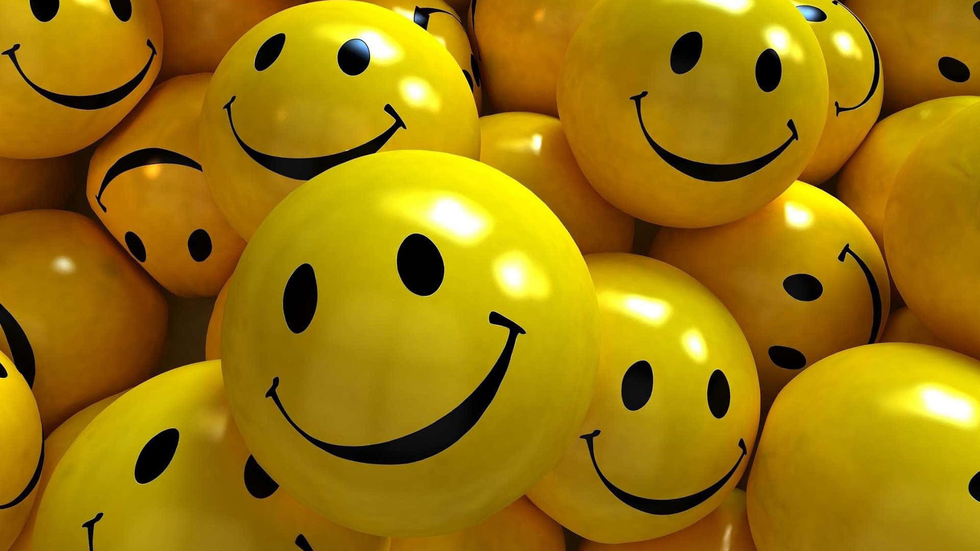 Smile 桌布 壁紙 — 一簇密集的光澤黃色笑臉氣球，帶有黑色彎曲笑容和點狀眼睛。