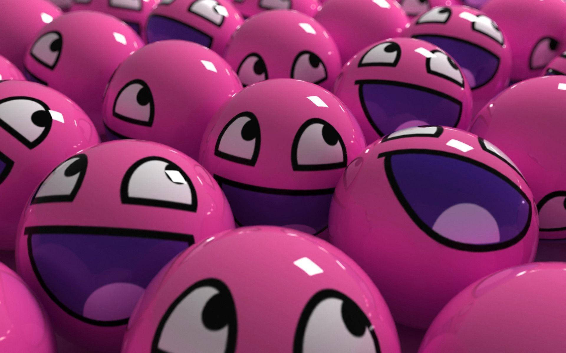 Cute Computer 桌布 壁紙 — 一組密集的光澤粉紅色球體，帶有卡通眼睛和張開大笑的嘴巴。