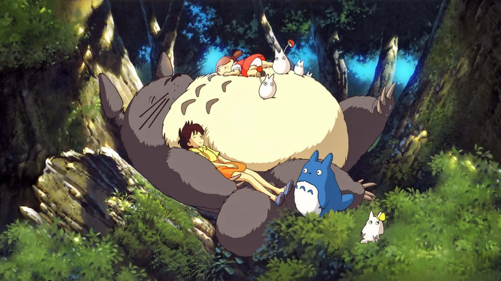 一群人坐在巨型龍貓的頭上 — 龍貓 GIF 壁紙