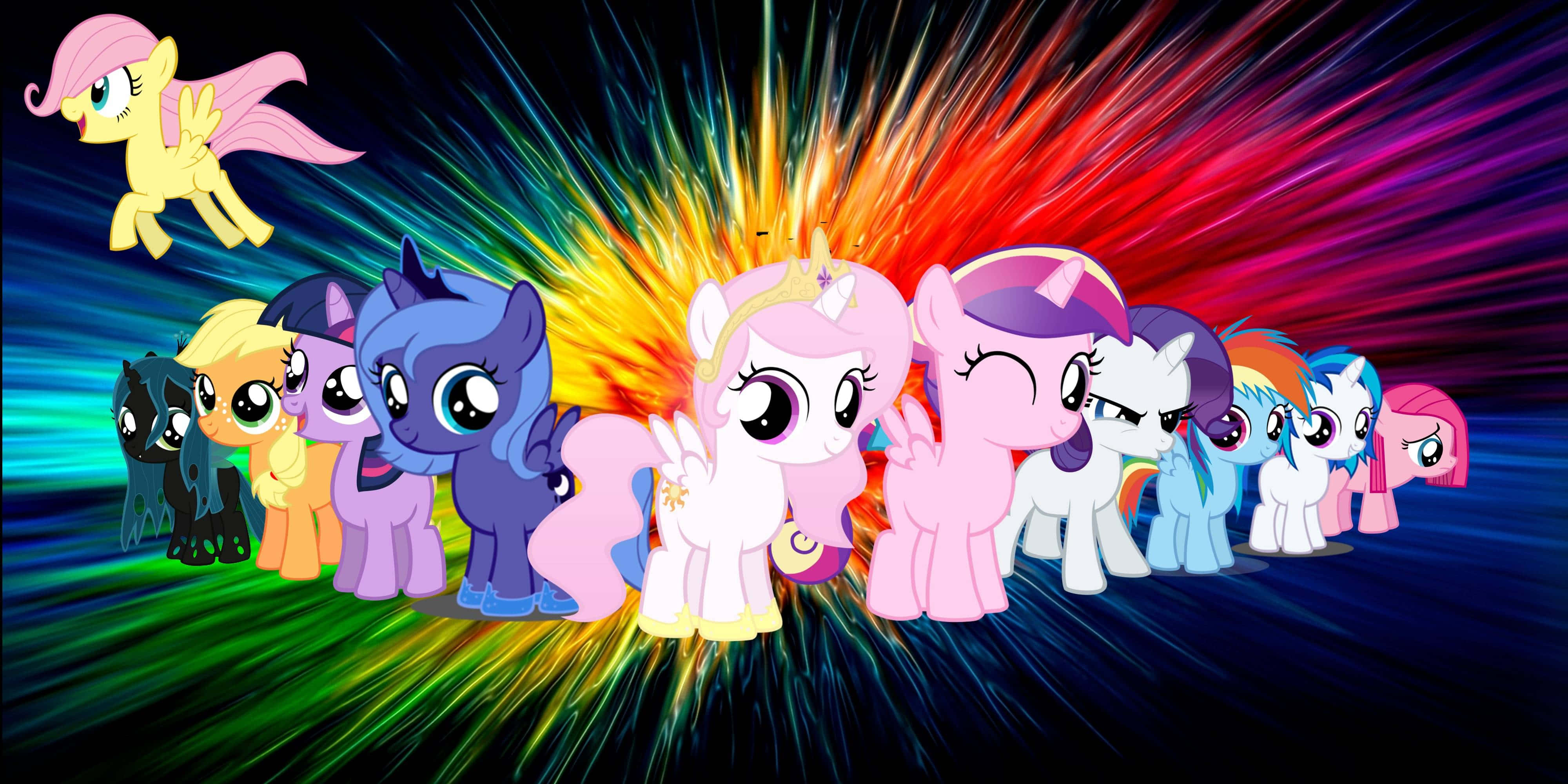 pony 桌布 壁紙 — 一群充滿活力的My Little Pony角色在燦爛的彩虹爆炸背景前擺姿勢。