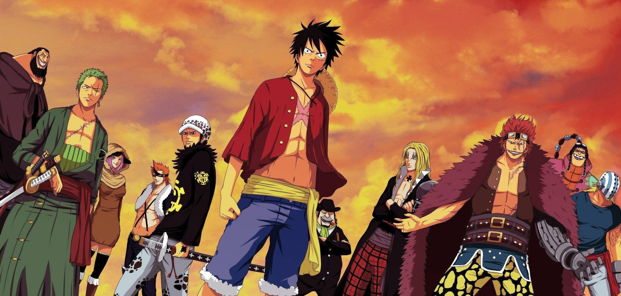 Luffy 桌布 壁紙 — 一群動漫海盜在熾熱的橙色夕陽天空下英勇地站立。