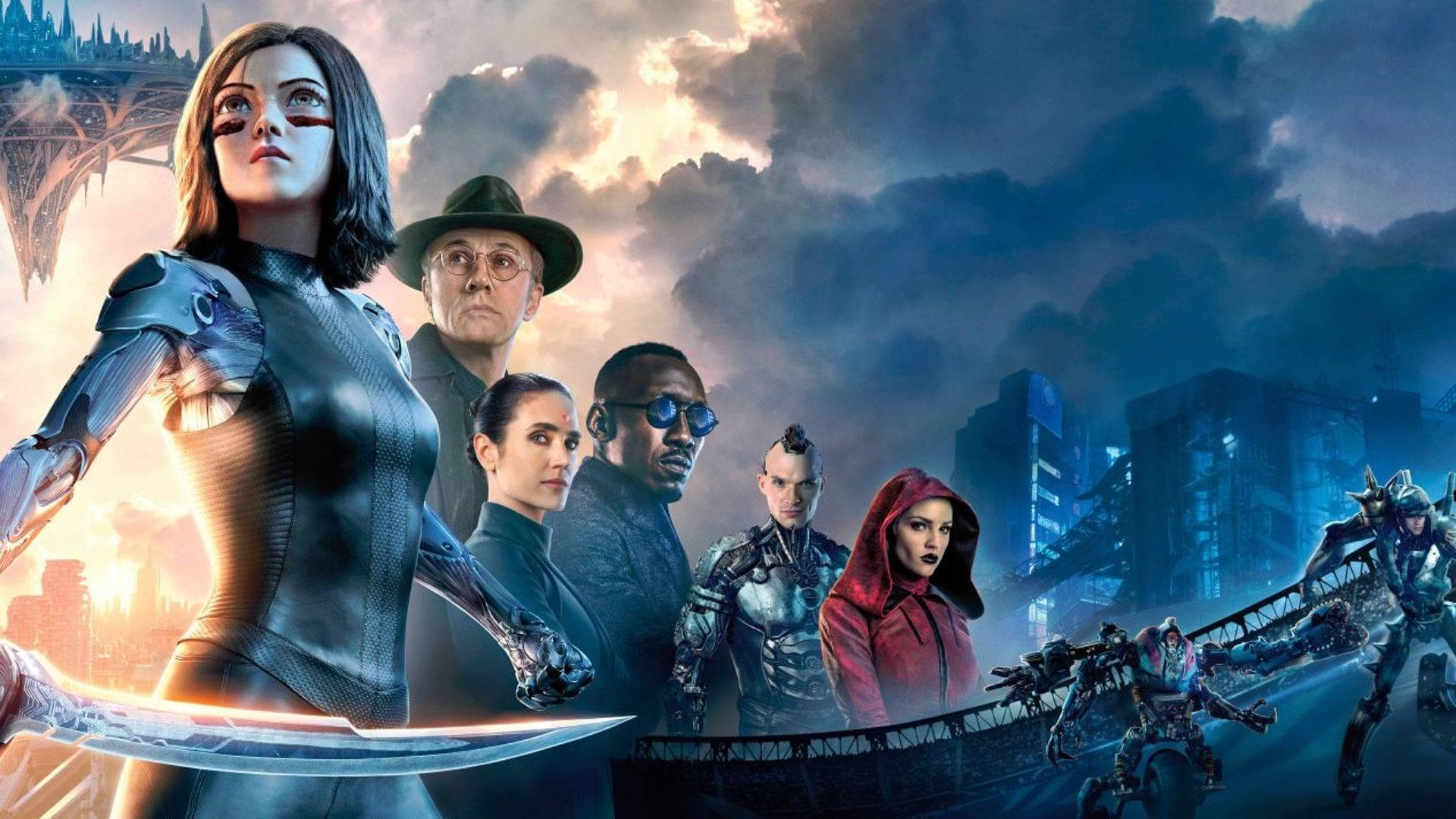 Alita Battle Angel 桌布 壁紙 — 一群多元化的超級英雄在風暴般的未來城市景觀中，面對著發光的霓虹燈和機械結構，堅定地站立。