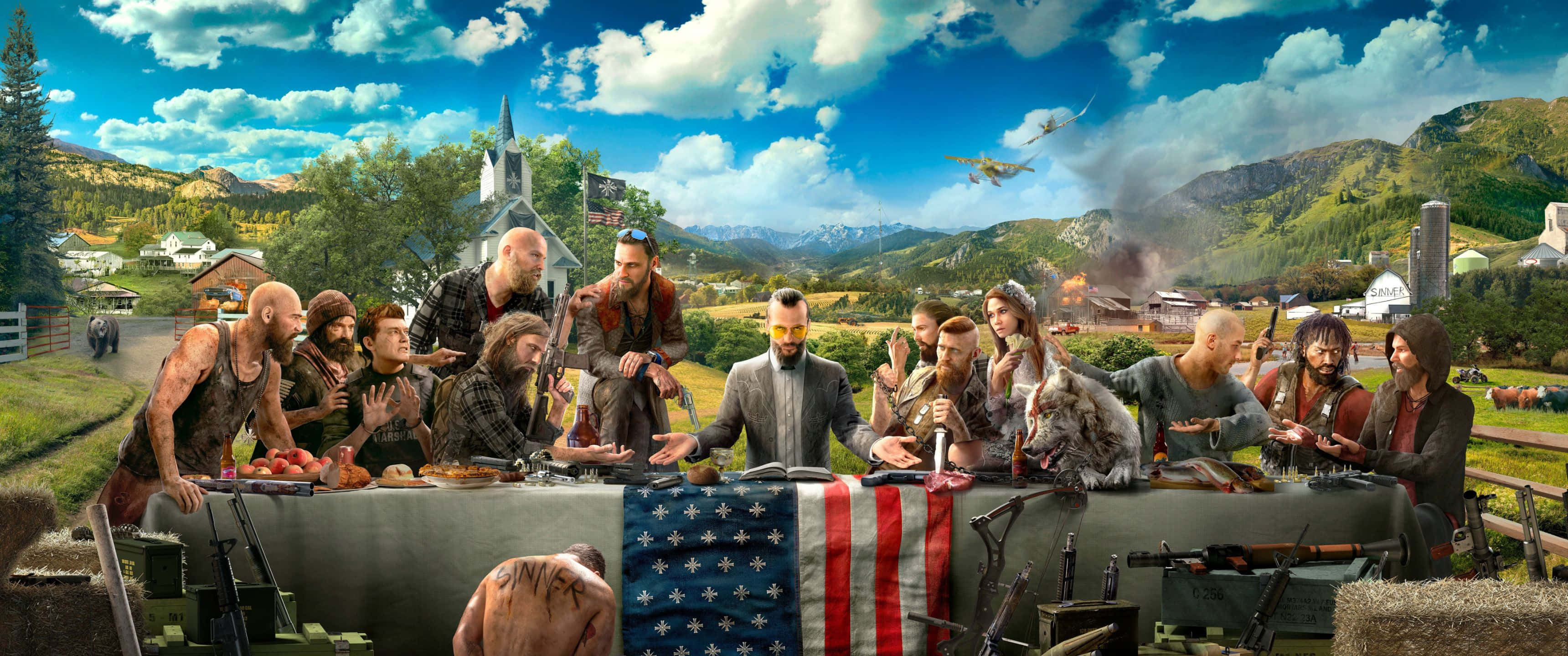3440x1440p Far Cry 5 桌布 壁紙 — 一群強壯的男女坐在一張長桌旁，桌上擺滿食物和武器，背景是晴朗的藍天白雲。
