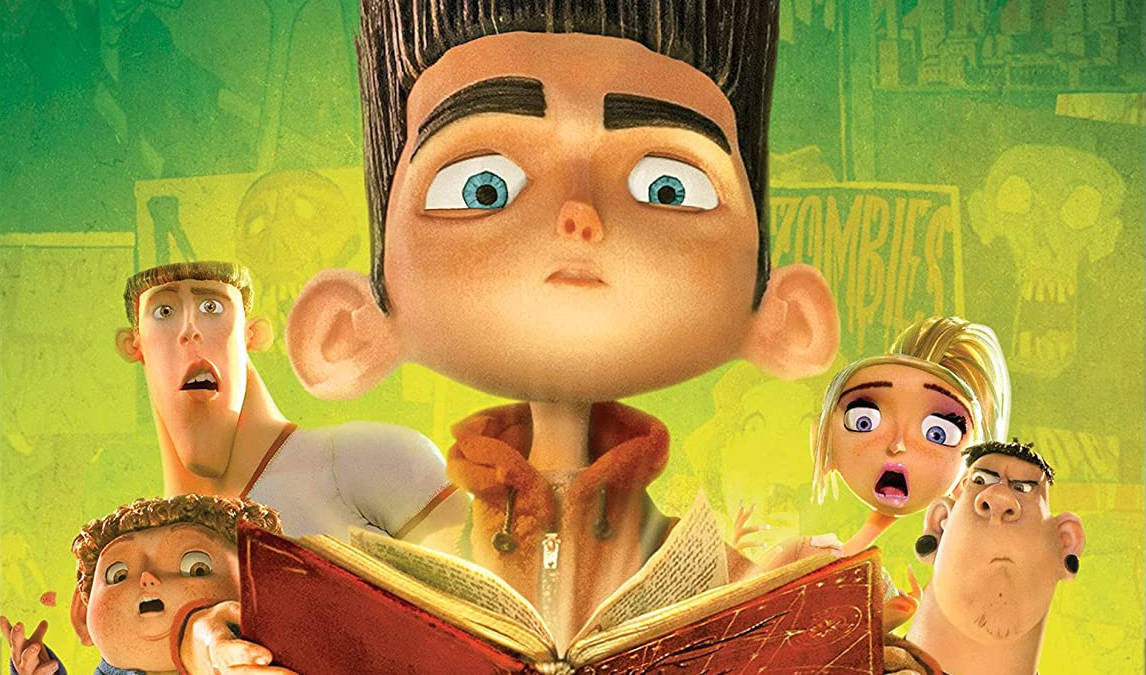 Animated 桌布 壁紙 — 一群睜大眼睛的動畫角色圍著一個在綠色塗鴉牆前看書的男孩。