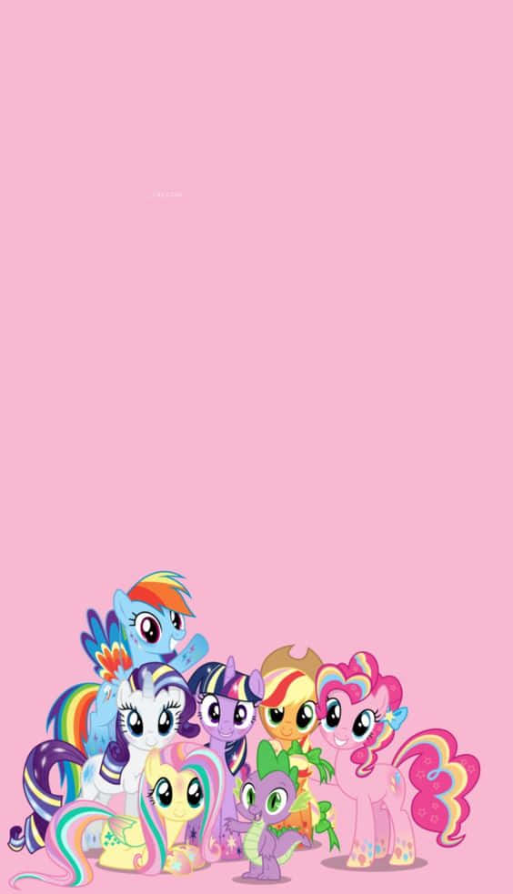 Mlp Phone 桌布 壁紙 — 一群色彩繽紛的卡通小馬，擁有彩虹鬃毛和尾巴，聚集在純粉紅色背景的底部。