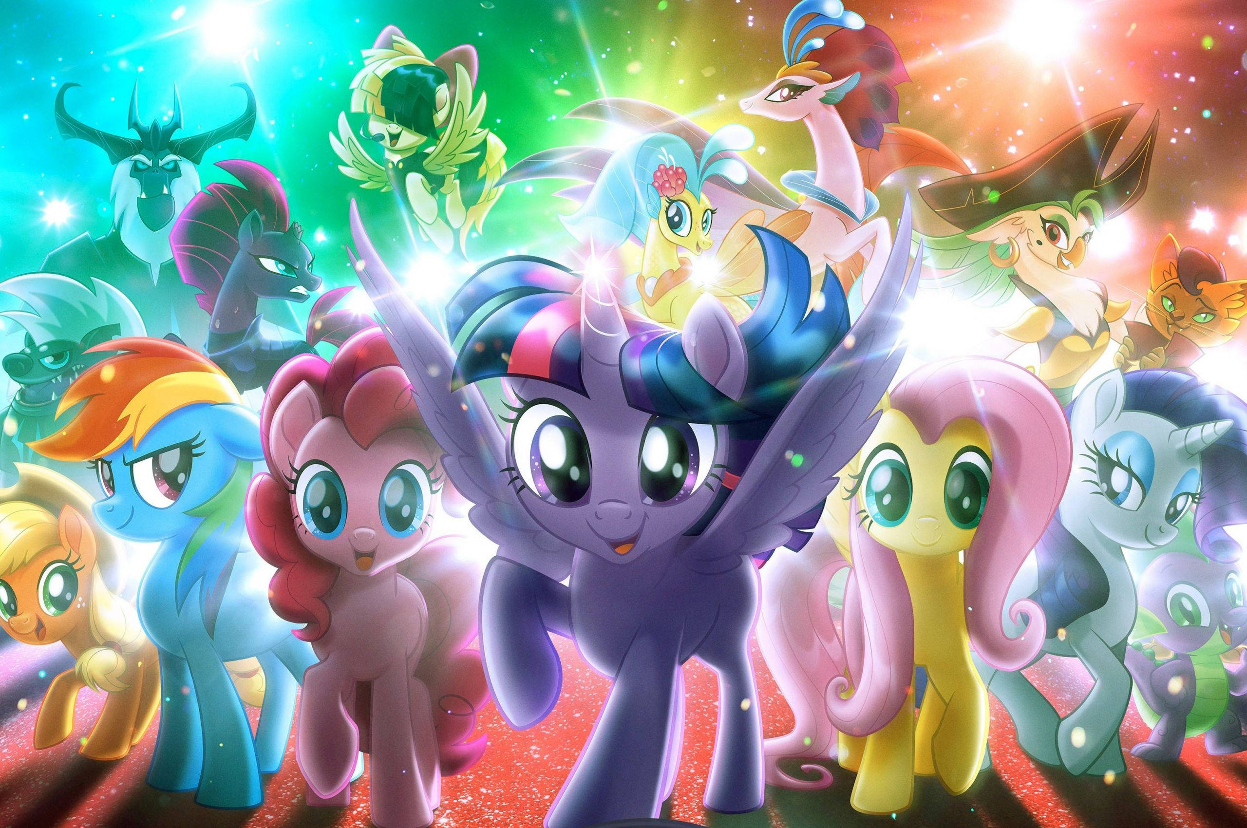 My Little Pony Desktop 桌布 壁紙 — 一群色彩繽紛的卡通小馬，眼睛發光，帶有魔法閃爍，站在光芒四射的宇宙背景前。