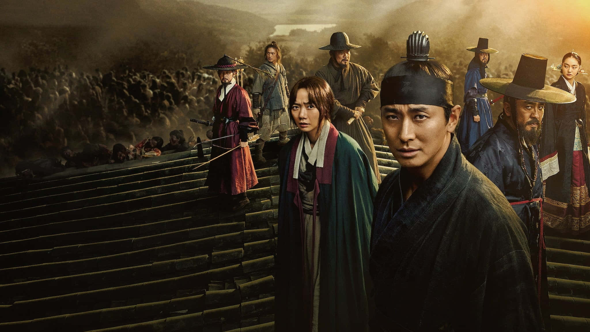 Kingdom 桌布 壁紙 — 一群身穿傳統盔甲的韓國戰士站在石階上，俯瞰著霧氣瀰漫的黎明中倒下的士兵的戰場。