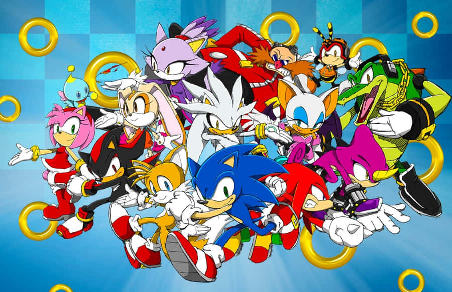 Sonic Characters 桌布 壁紙 — 一群音速小子角色在藍色格紋背景上擺出動感動作姿勢，周圍漂浮著金色圓環。