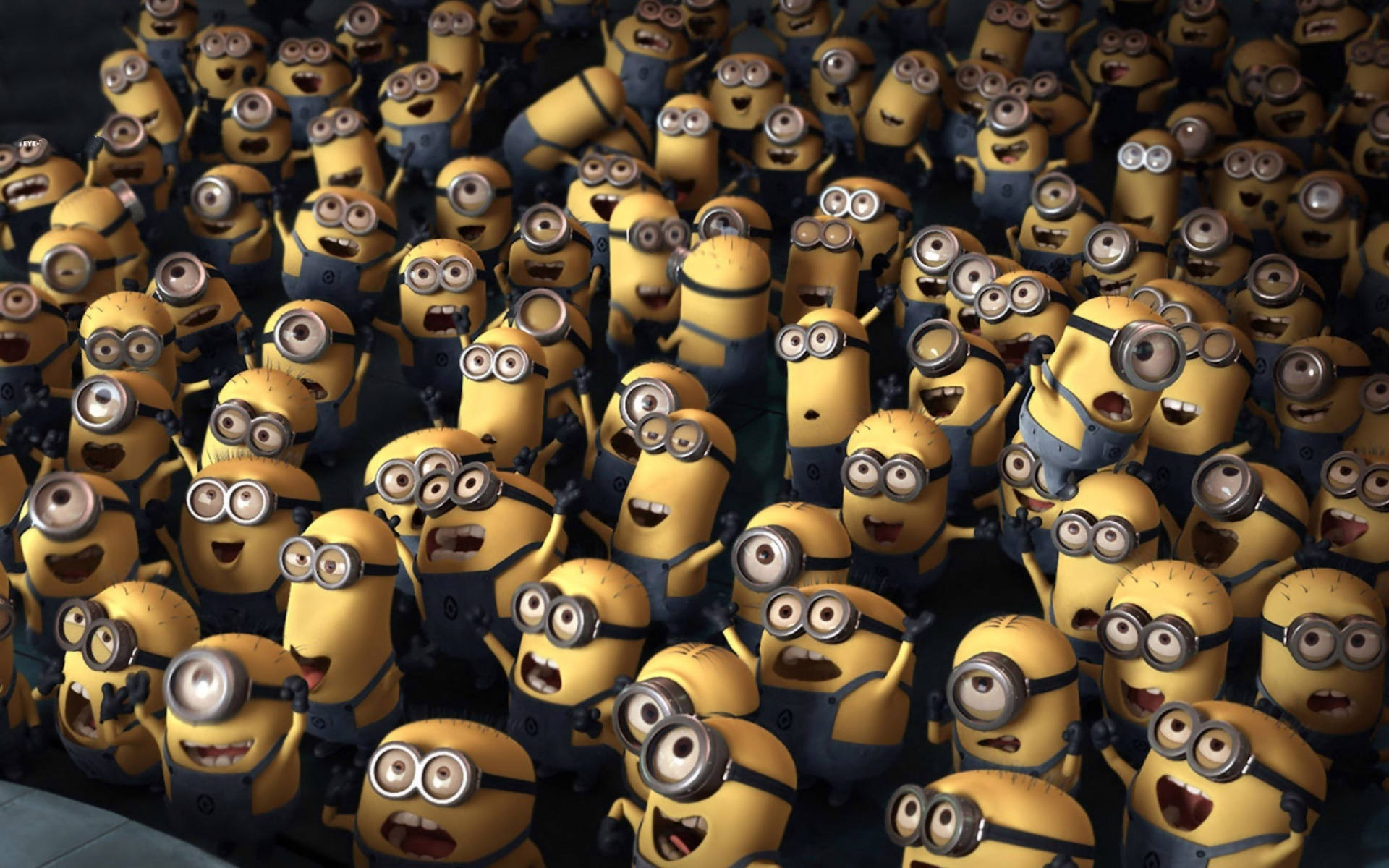 Despicable Me 2 桌布 壁紙 — 一群黃色小小兵身穿藍色吊帶褲，戴著護目鏡，擠在一起，露出燦爛的笑容。