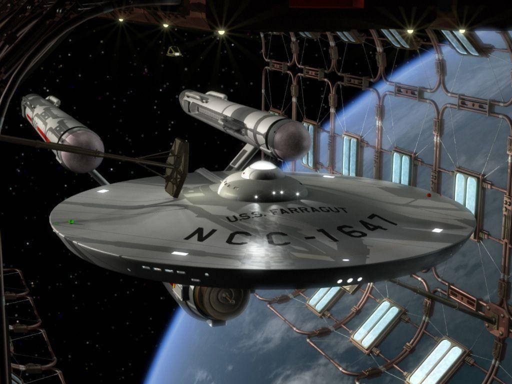 Starship 桌布 壁紙 — 一艘名為 U.S.S. Farragut NCC-1647 的銀色星艦停靠在太空站內，背景可見地球。