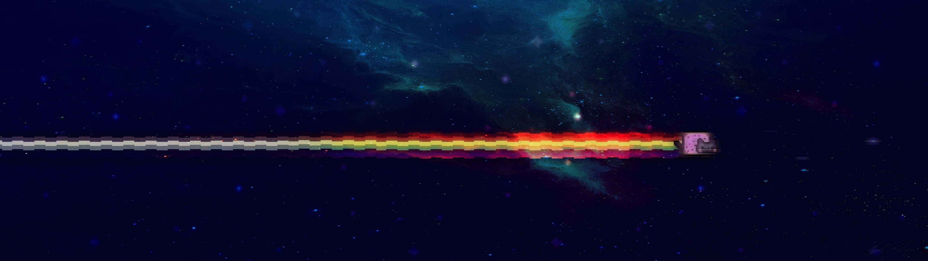 桌布 壁紙 — 一艘太空船在佈滿星星的宇宙星雲中留下充滿活力的彩虹軌跡，星雲中有藍綠色和紫色的雲。