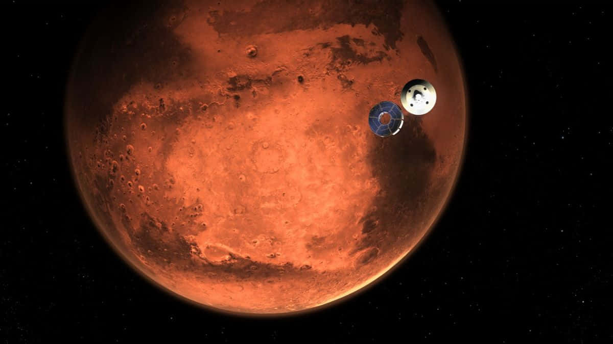 火星 桌布 壁紙 — 一艘太空船在佈滿星星的黑色虛空中環繞著生鏽紅色的火星運行。