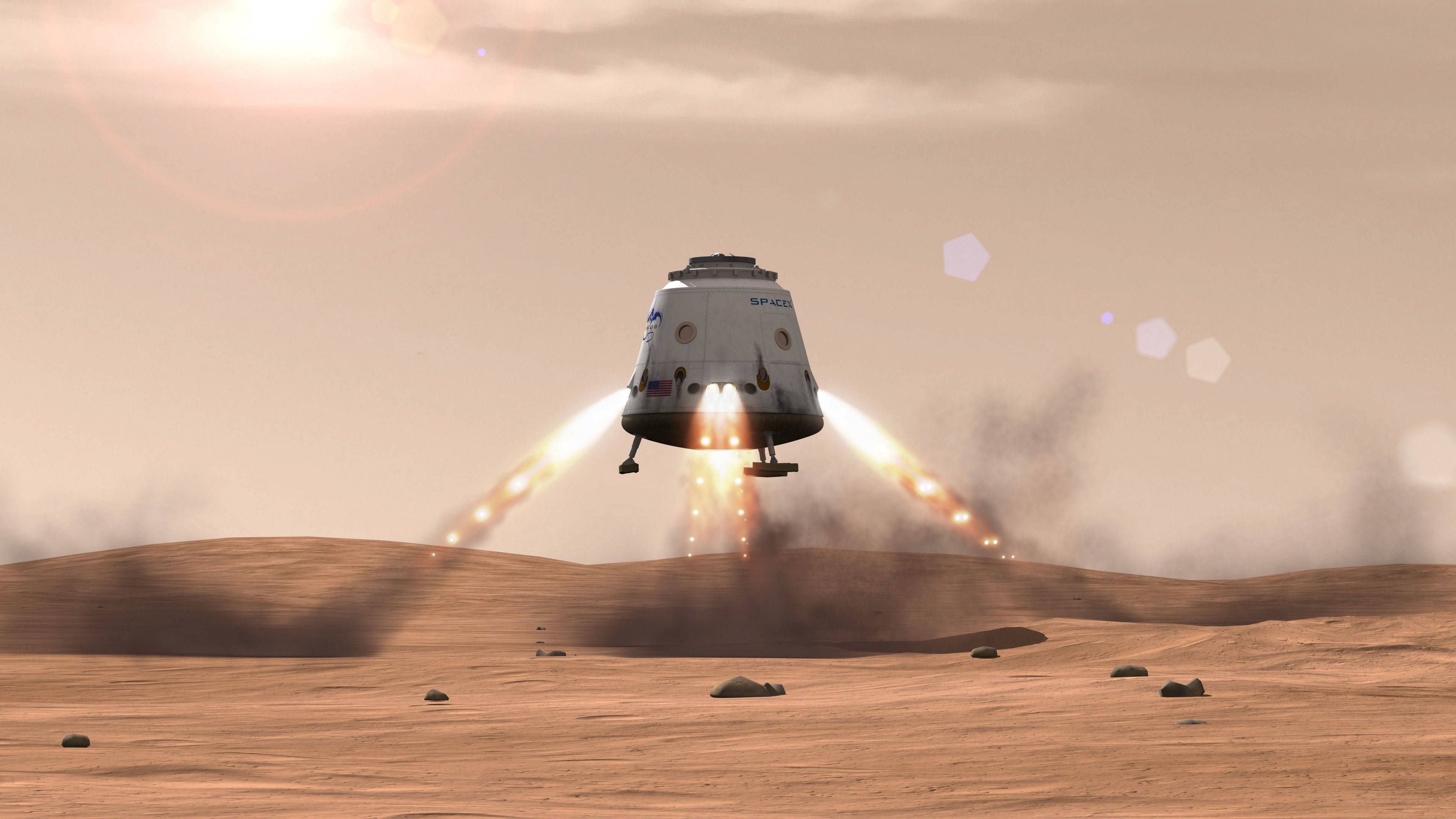 SpaceX 桌布 壁紙 — 一艘太空船在朦朧的太陽下，以熾熱的推進器降落在塵土飛揚的外星沙漠上。