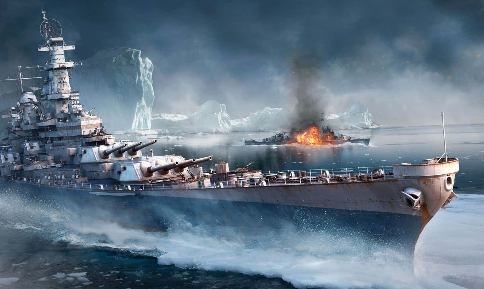 Battleship 桌布 壁紙 — 一艘巨大的戰艦劃破冰冷的海水，一艘燃燒的敵艦在風暴天空下高聳的冰山之間沉沒。