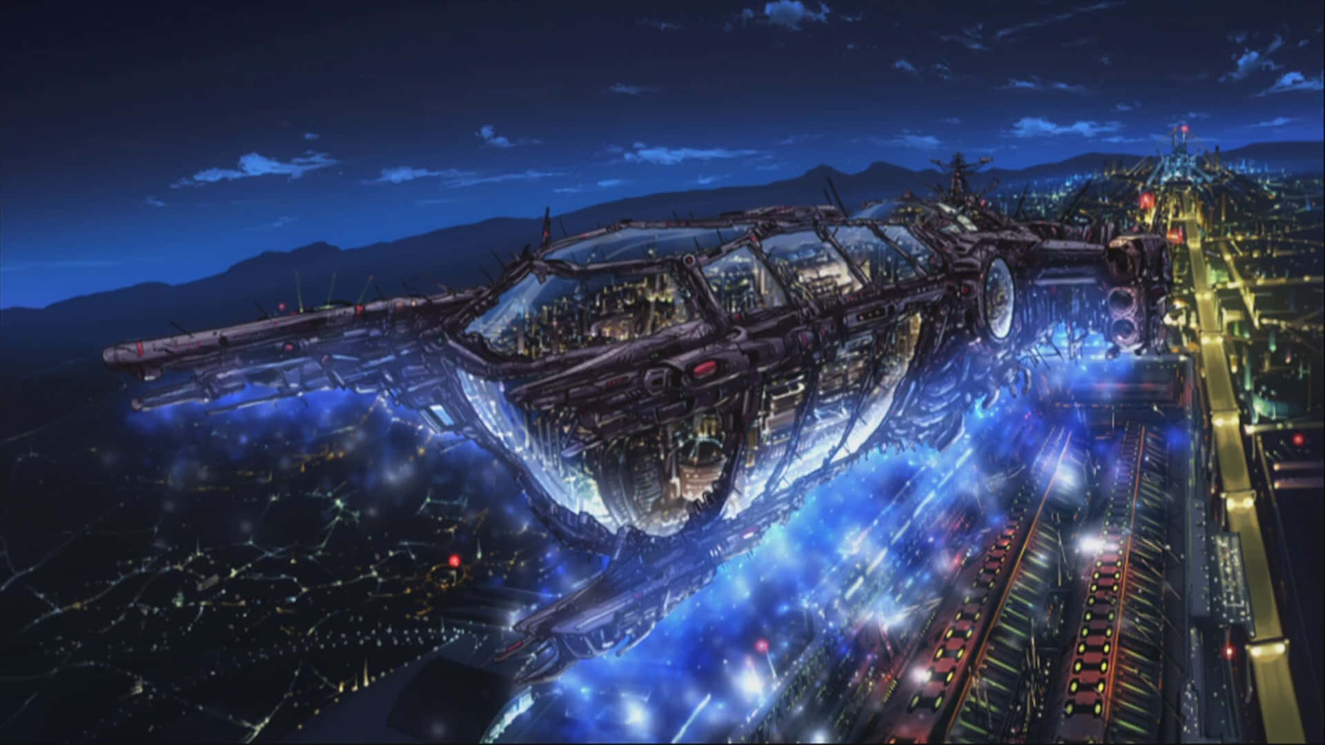 Macross Delta 桌布 壁紙 — 一艘巨大的未來主義太空船在夜晚懸浮於霓虹燈閃爍的城市上空，帶有發光的藍色能量痕跡。