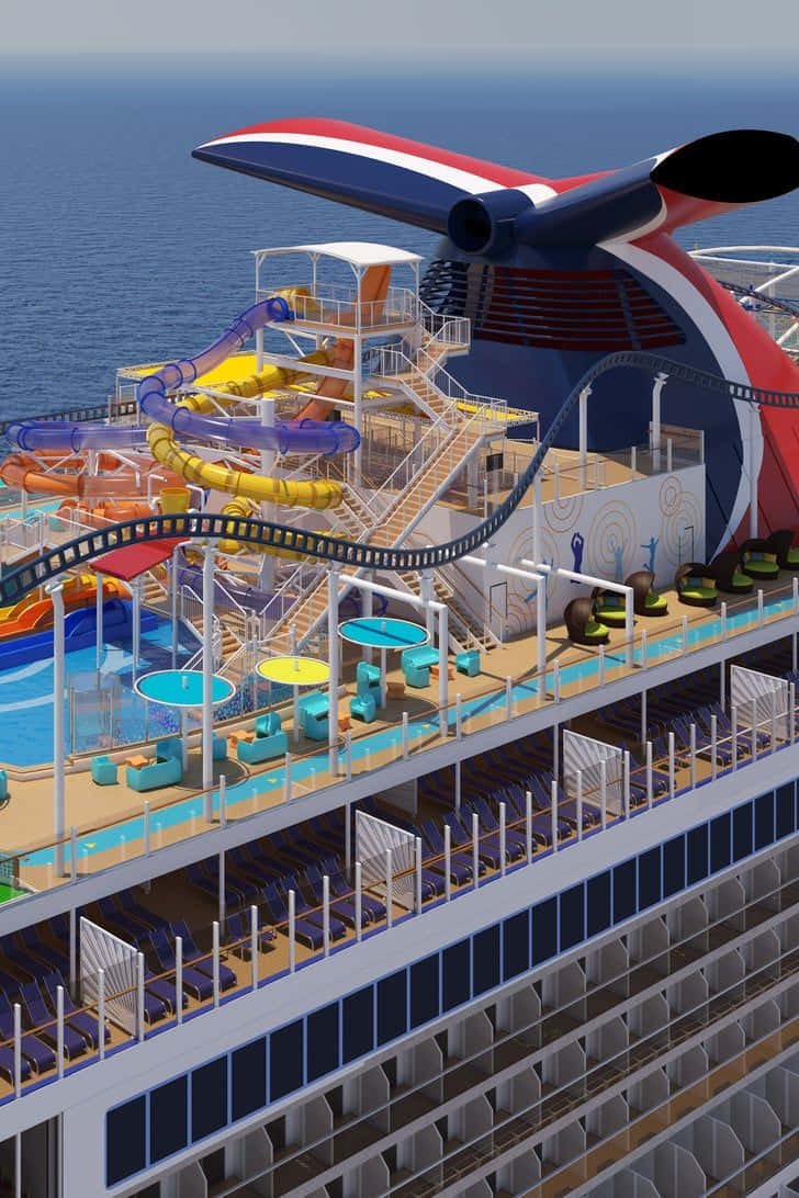Cruise 桌布 壁紙 — 一艘巨大的郵輪，配備色彩繽紛的水滑梯和游泳池，在晴朗的天空下平靜的藍色海洋上滑行。